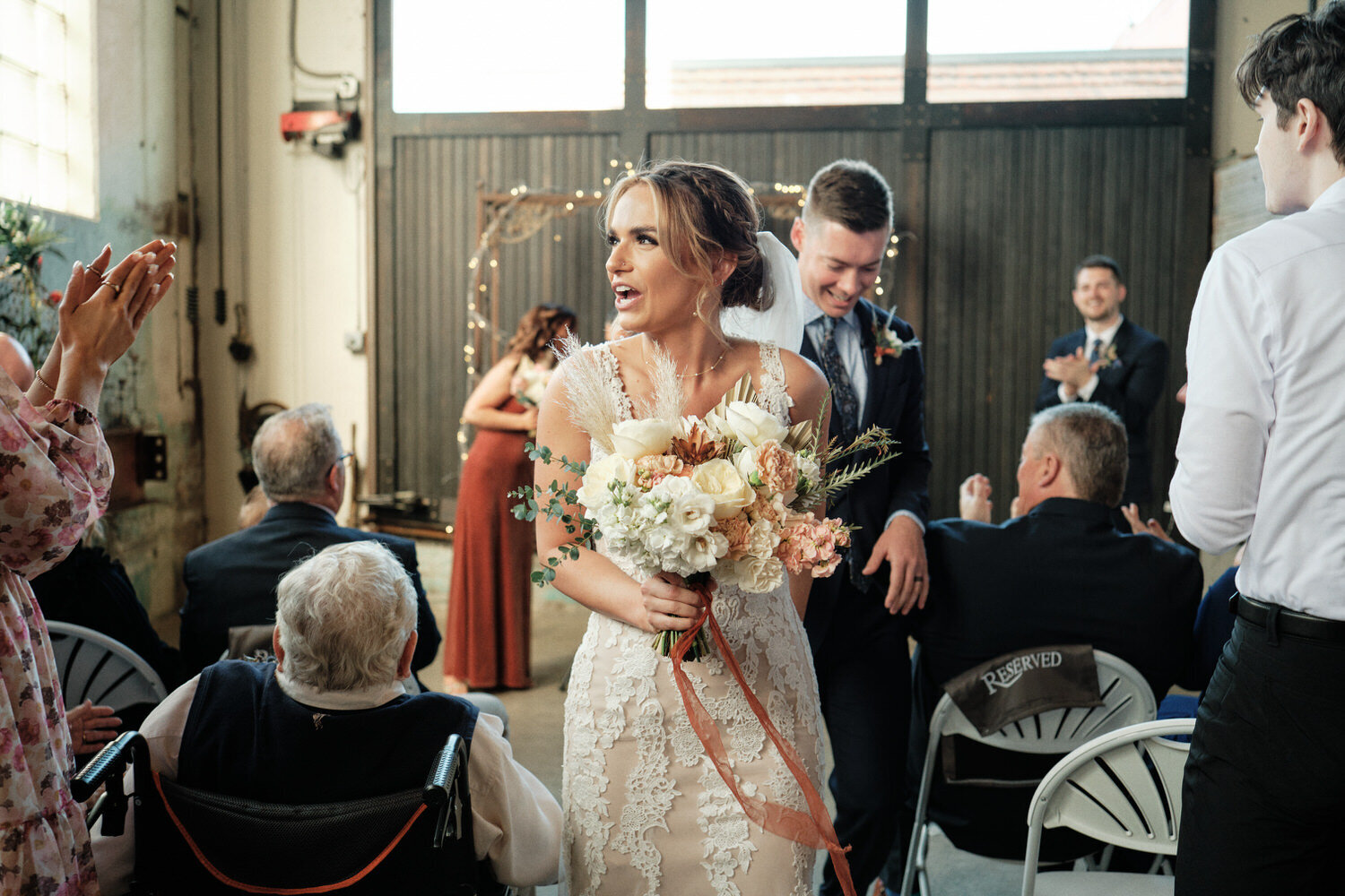 Bride and groom walk up the aisle at the Press Room, Tacoma.