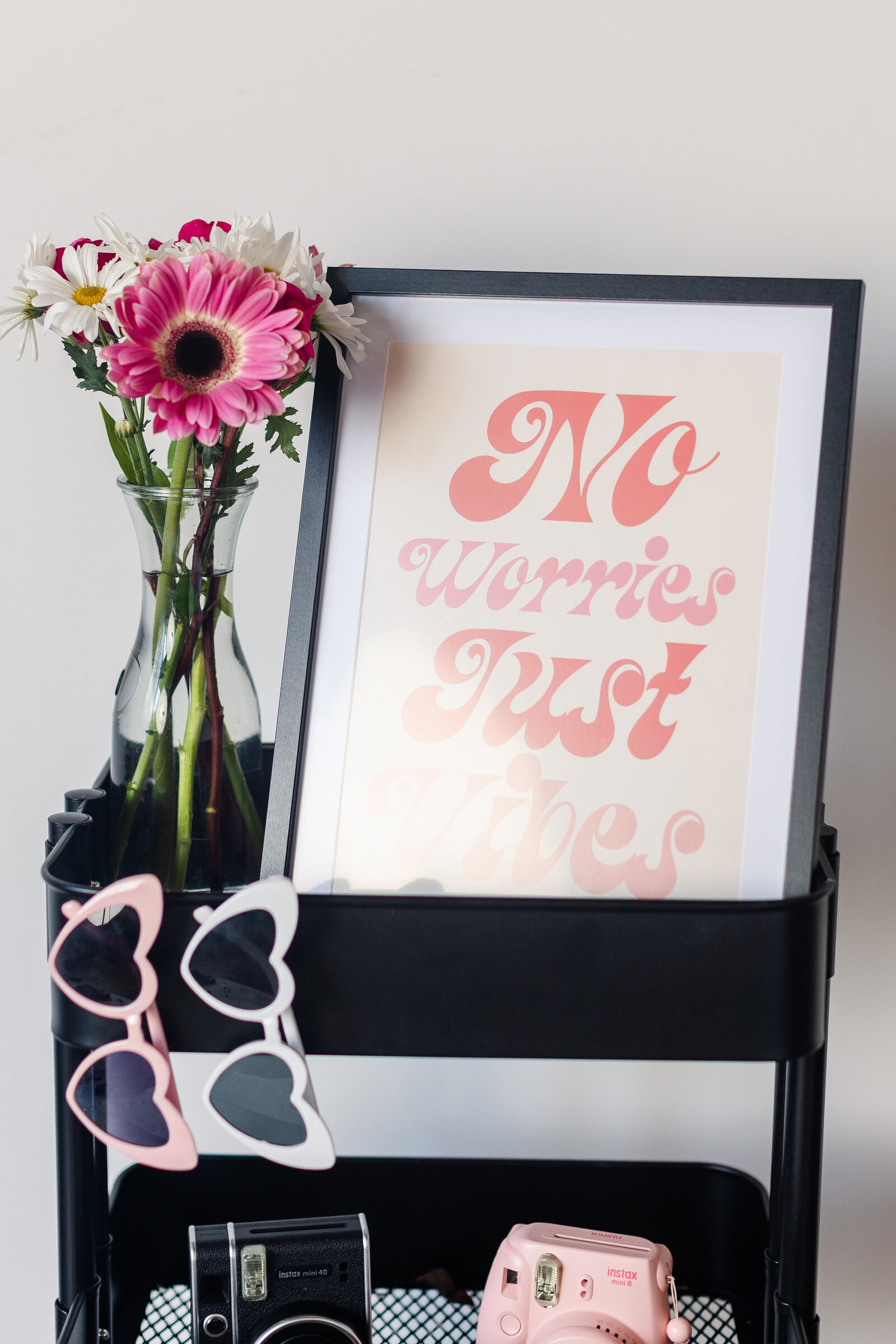 an art print, heart shaped glasses, and other details