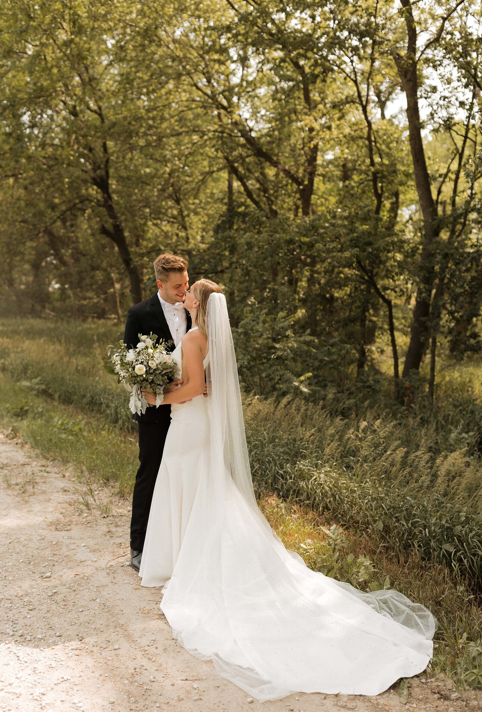 grace-trexel-photo-bride-groom-standing-outside-nebraska-wedding