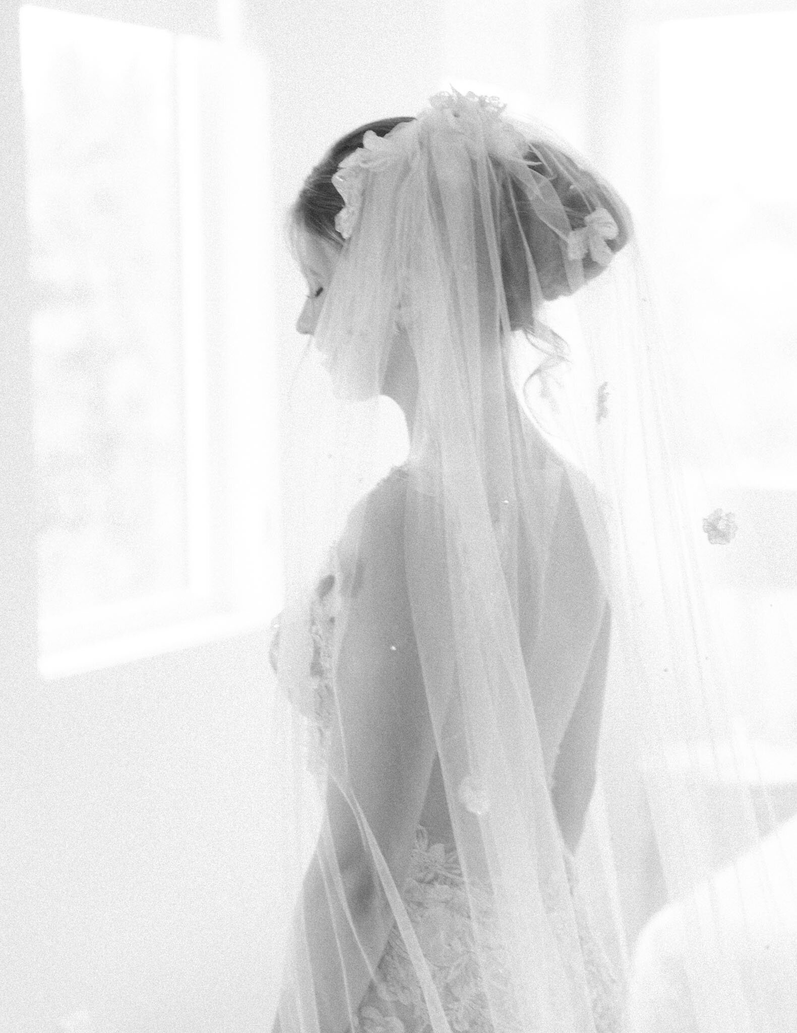 Bride profile in her gown in b&W