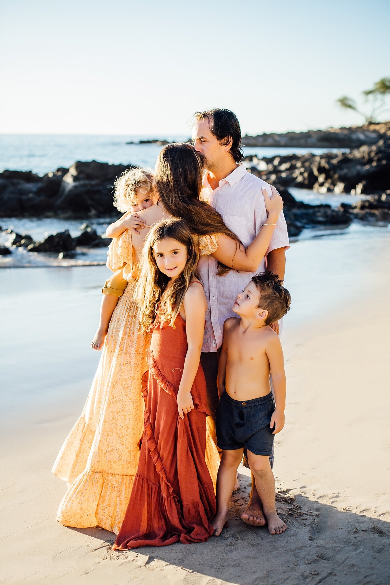 family of five on hawaii sandy beach