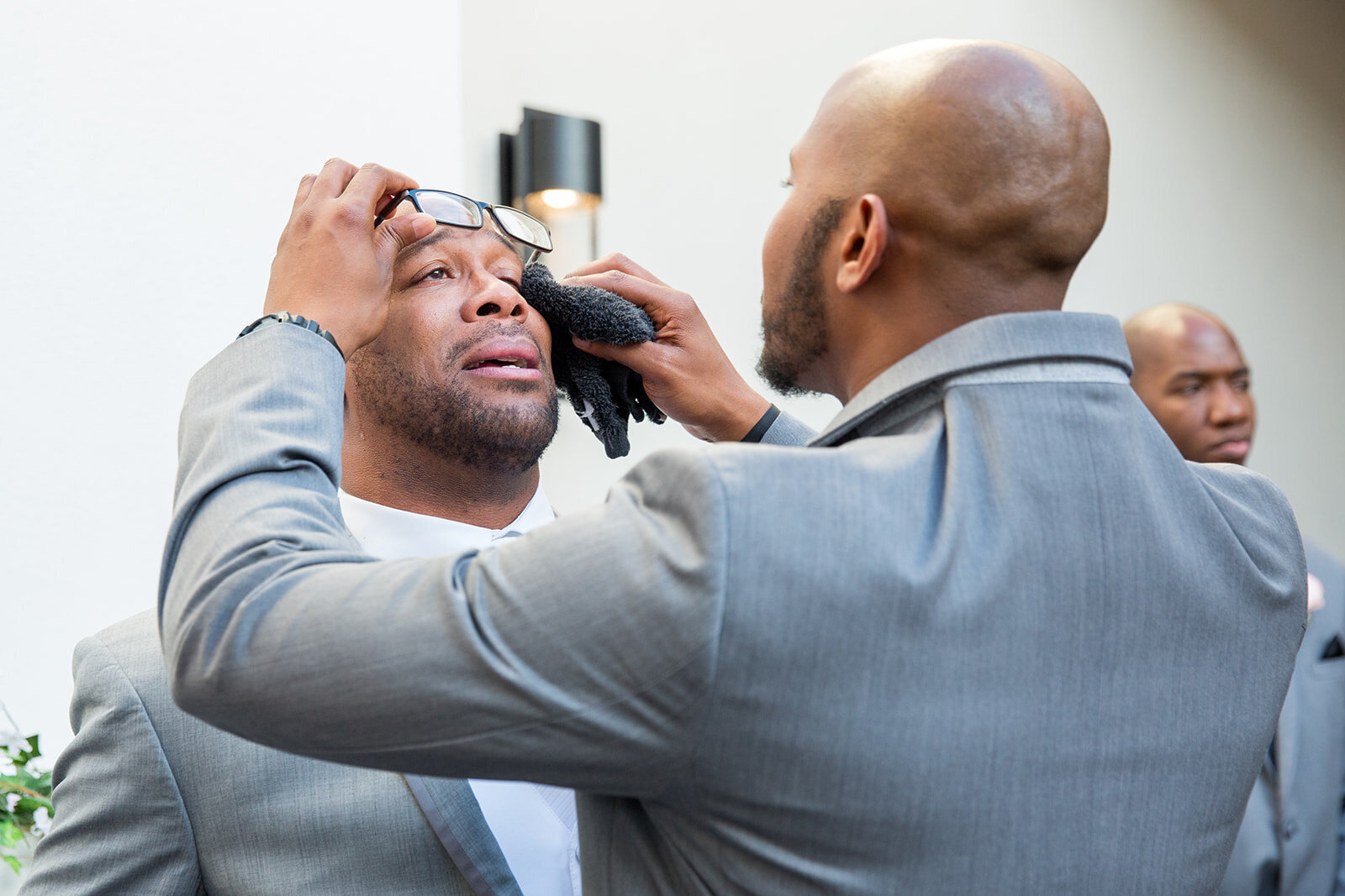 Groom crying when he sees his bride for the first time. Chandler, Arizona's best wedding photographers, DePoy Studios, captured this priceless moment.