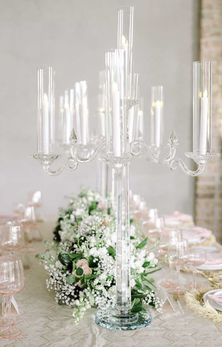 close up of wedding placements with acrylic candle holders