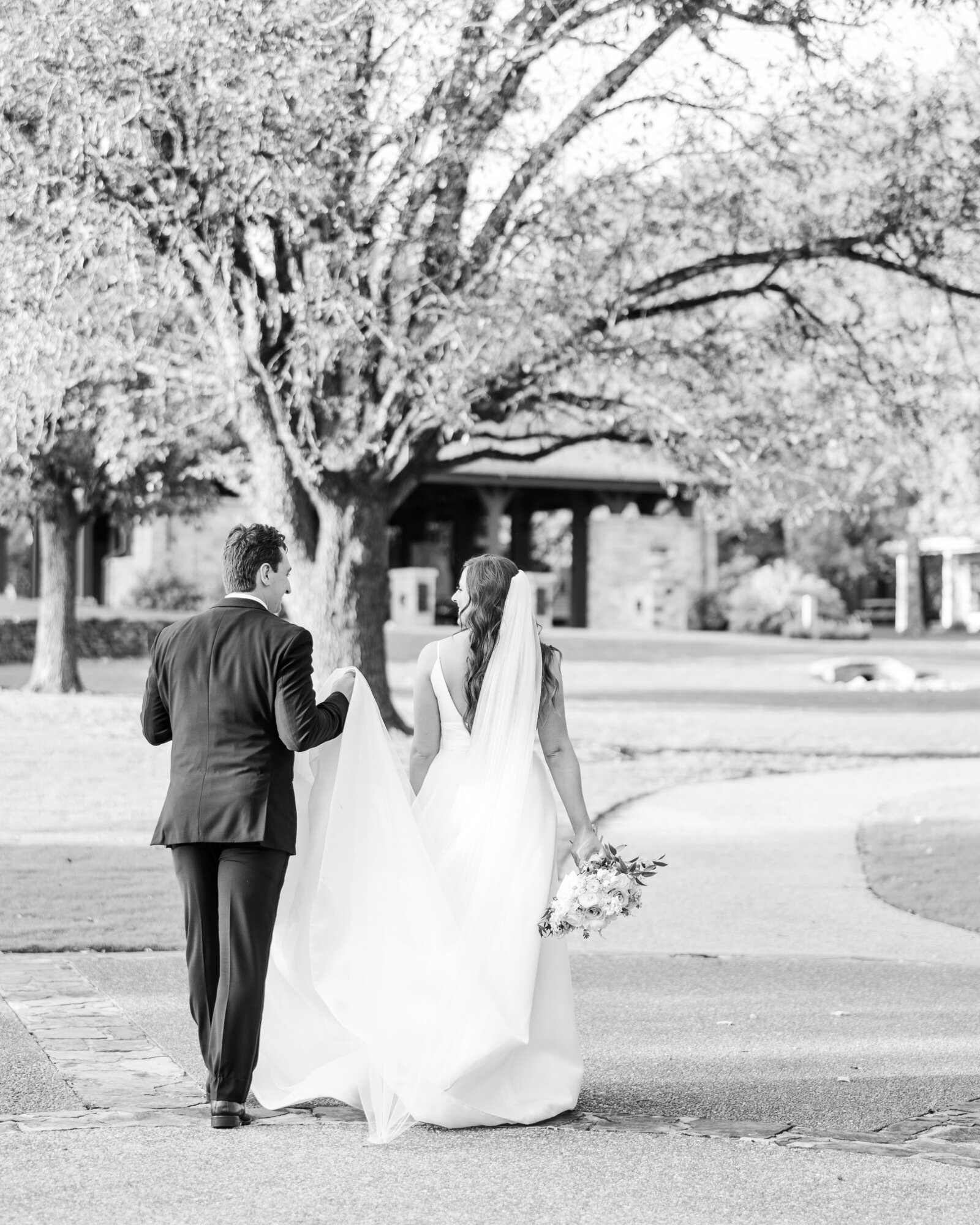 Sarah Kate and Thomas enjoying a heartfelt moment at their wedding, captured by a luxury Alabama wedding photographer.