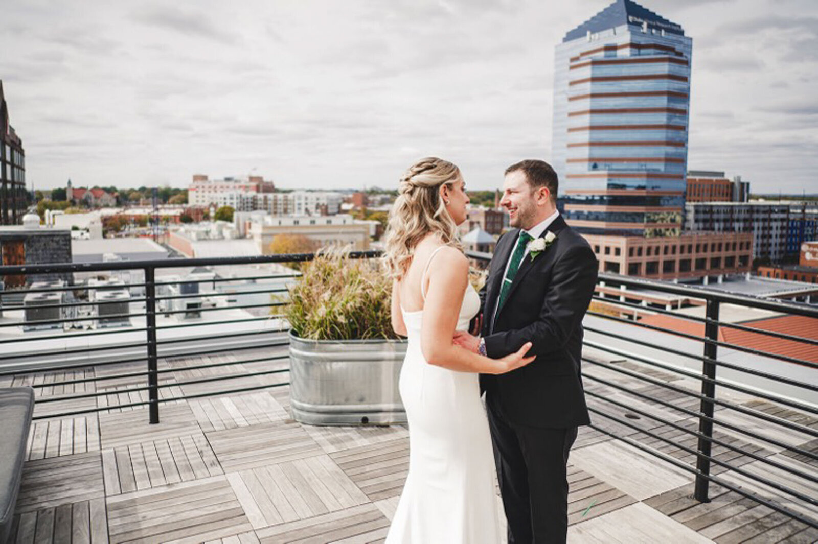 Bride and groom on roof in Raleigh North Carolina
