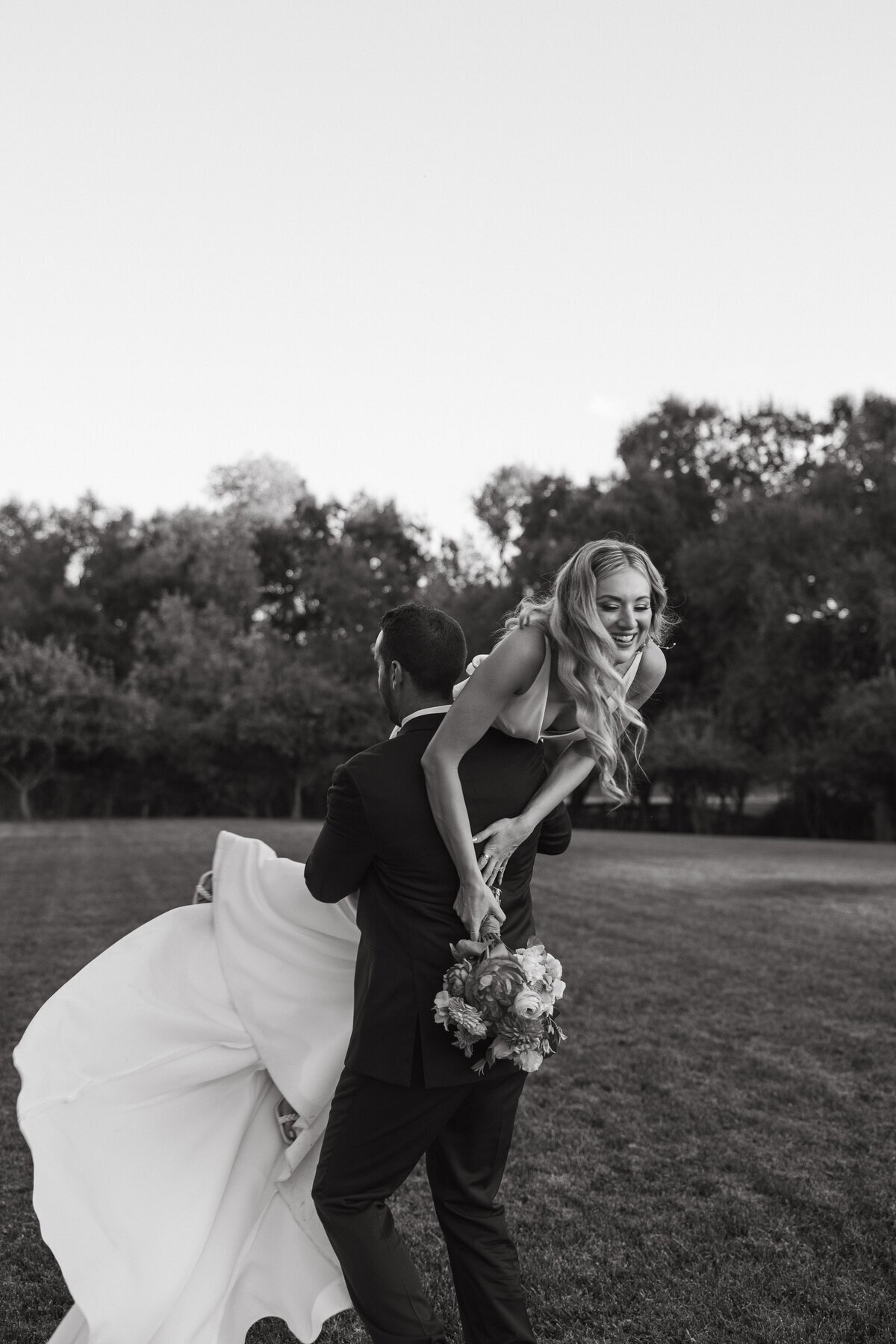 destination wedding photography with groom holding bride