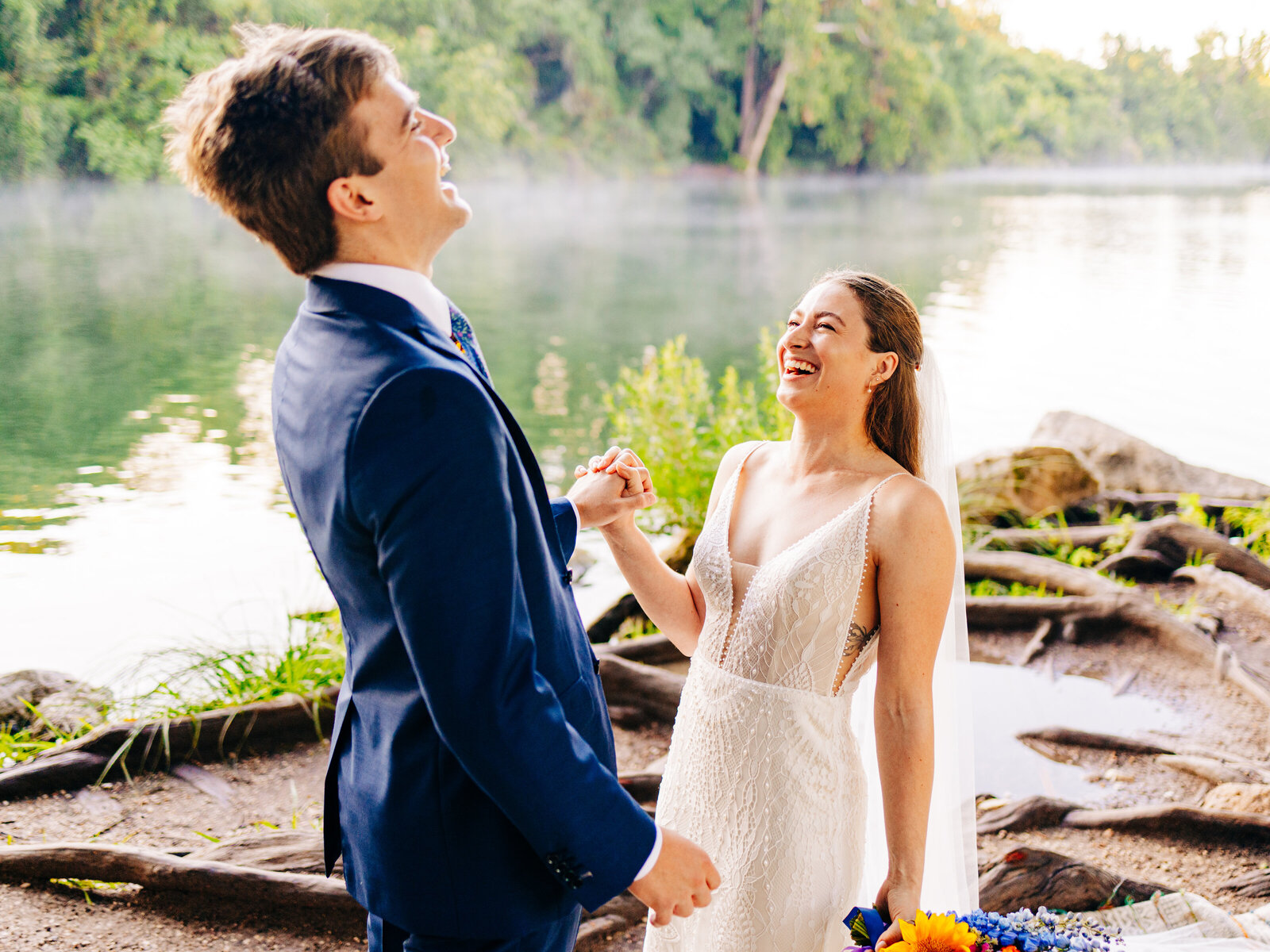 Bride and Groom laughing at Red Bud Isle