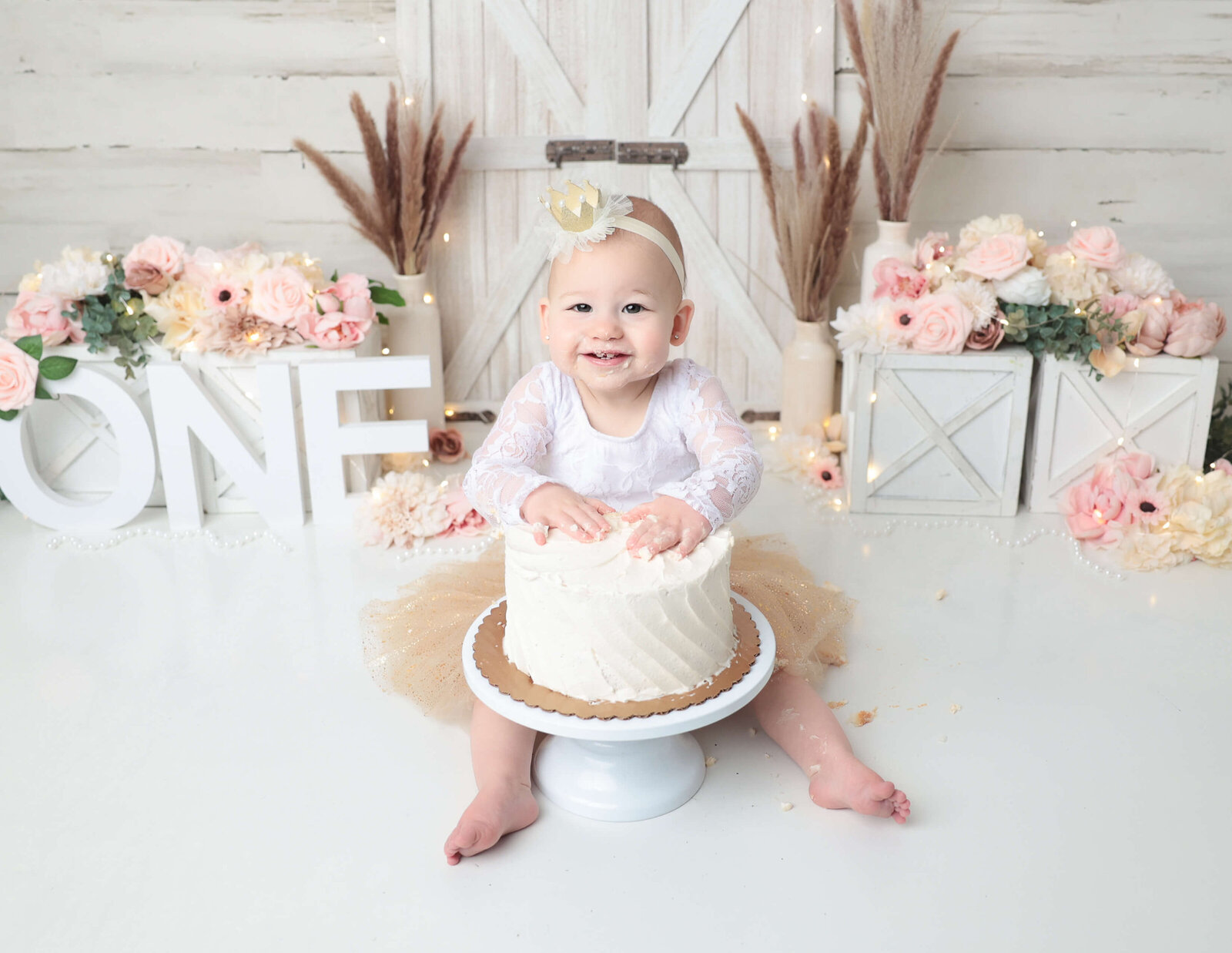 White and pink boho cake smash session at our Rochester, Ny studio.