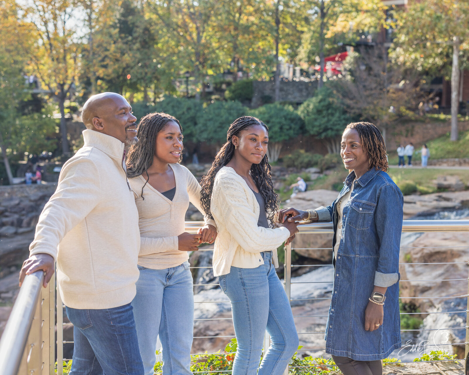 Outdoor family portrait glowing with natural light.