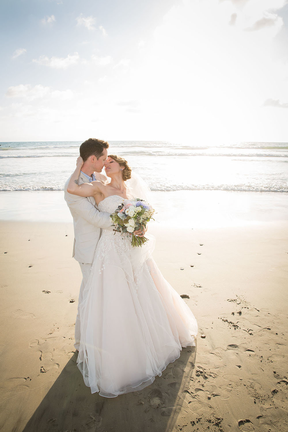 Romantic kiss on the beach in Del Mar
