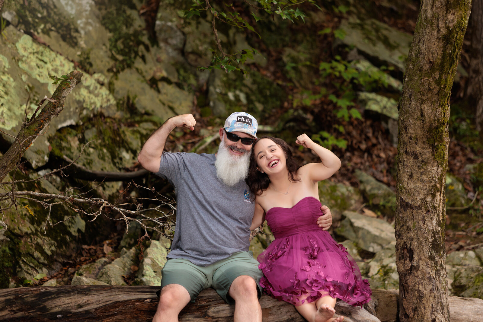 Father and Daughter on a tree by a river in Durham NC.
