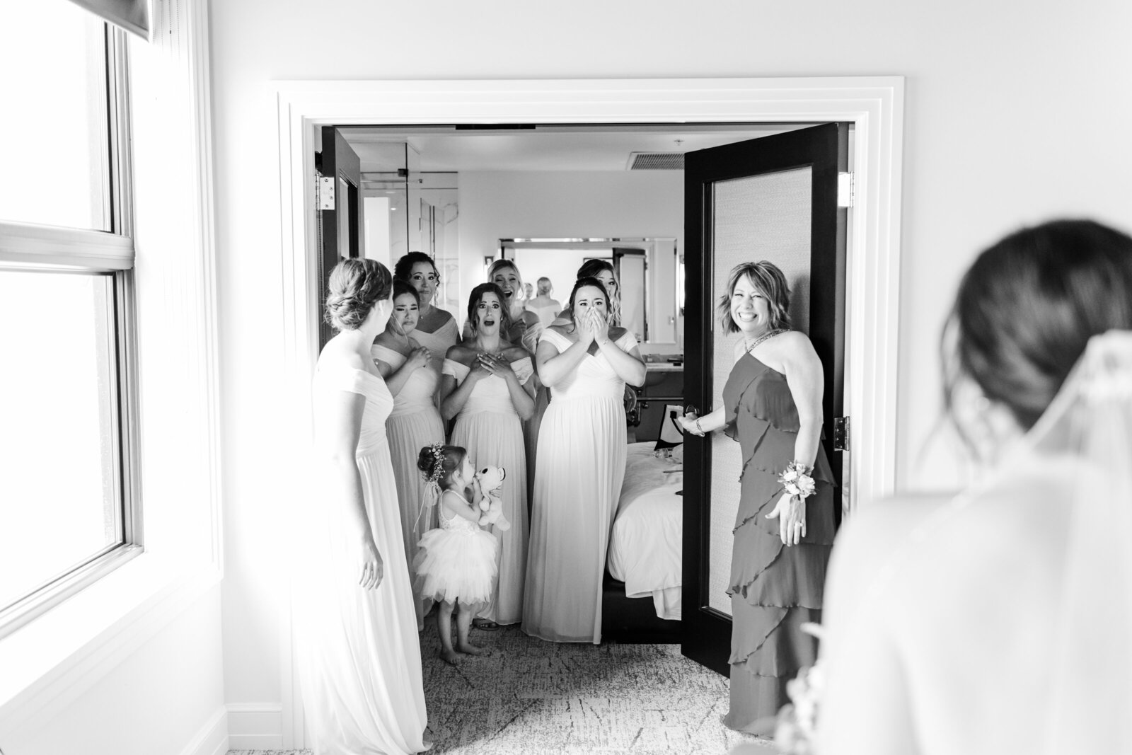 27_hotel_goodwin_beloit_illinois_bridesmaids_seeing_bride