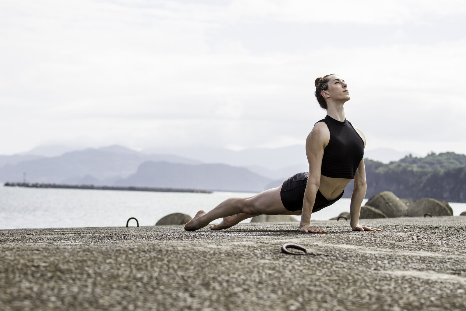female in yoga pose outside