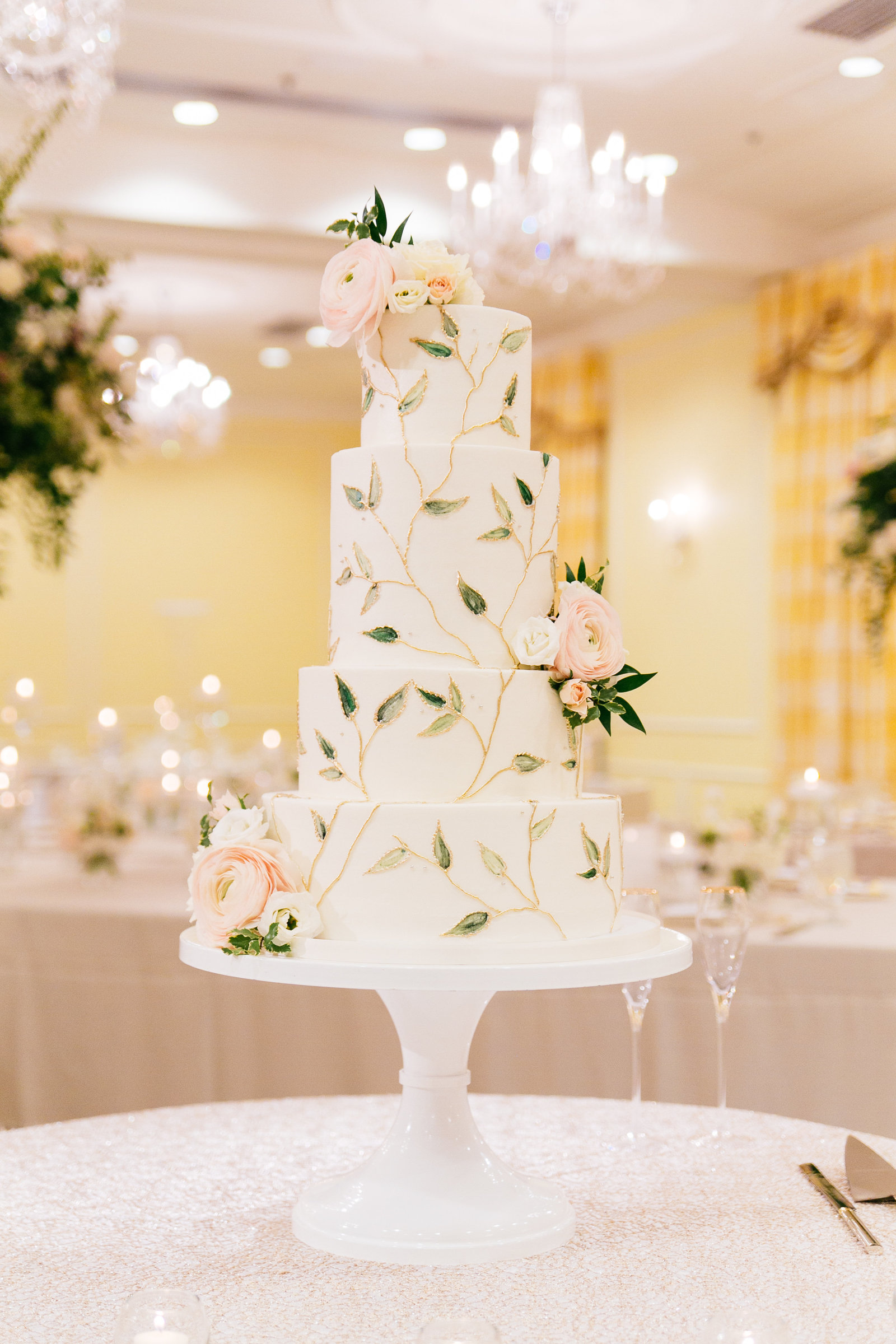Garden inspired white buttercream wedding cake with gold piped branches and hand painted leaves Events by La Fete