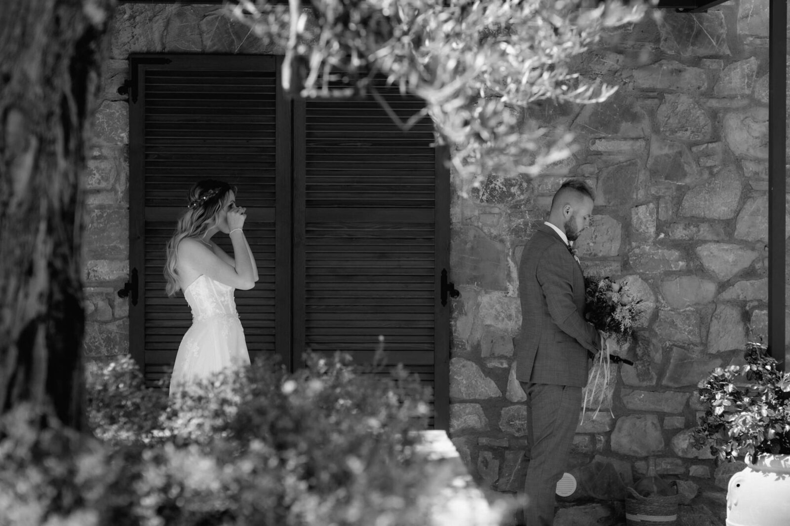 Bride prepares for the first look with her groom, close to tears.