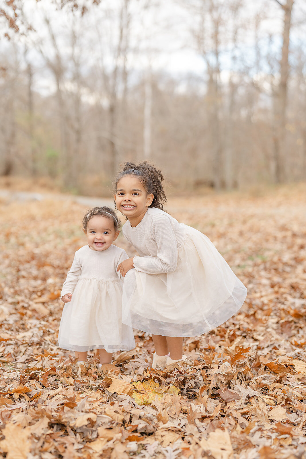 sisters smile during fall minis in Herndon, VA