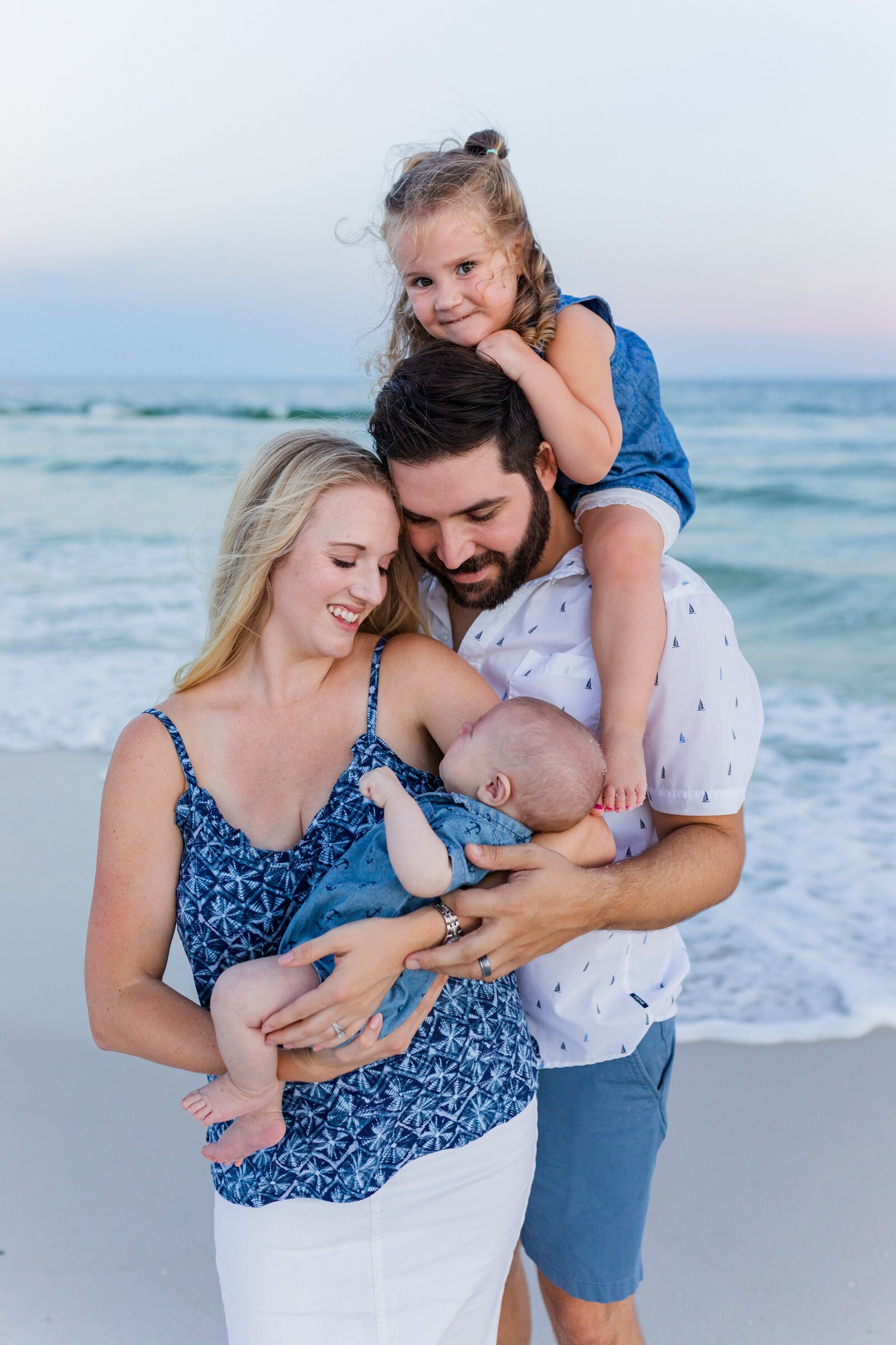 Family of four during photo session on Pensacola Beach