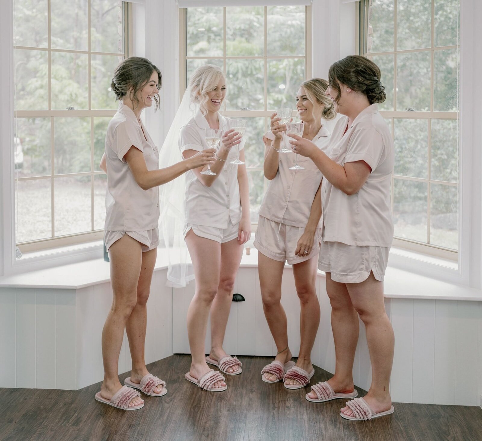Bride and bridesmaids in matching pajamas