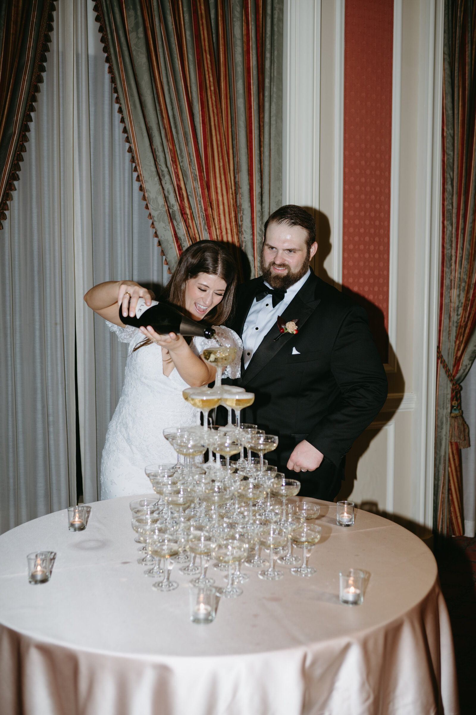 Bride and Groom with champagne tower at the Fort Worth Club in Fort Worth, Texas