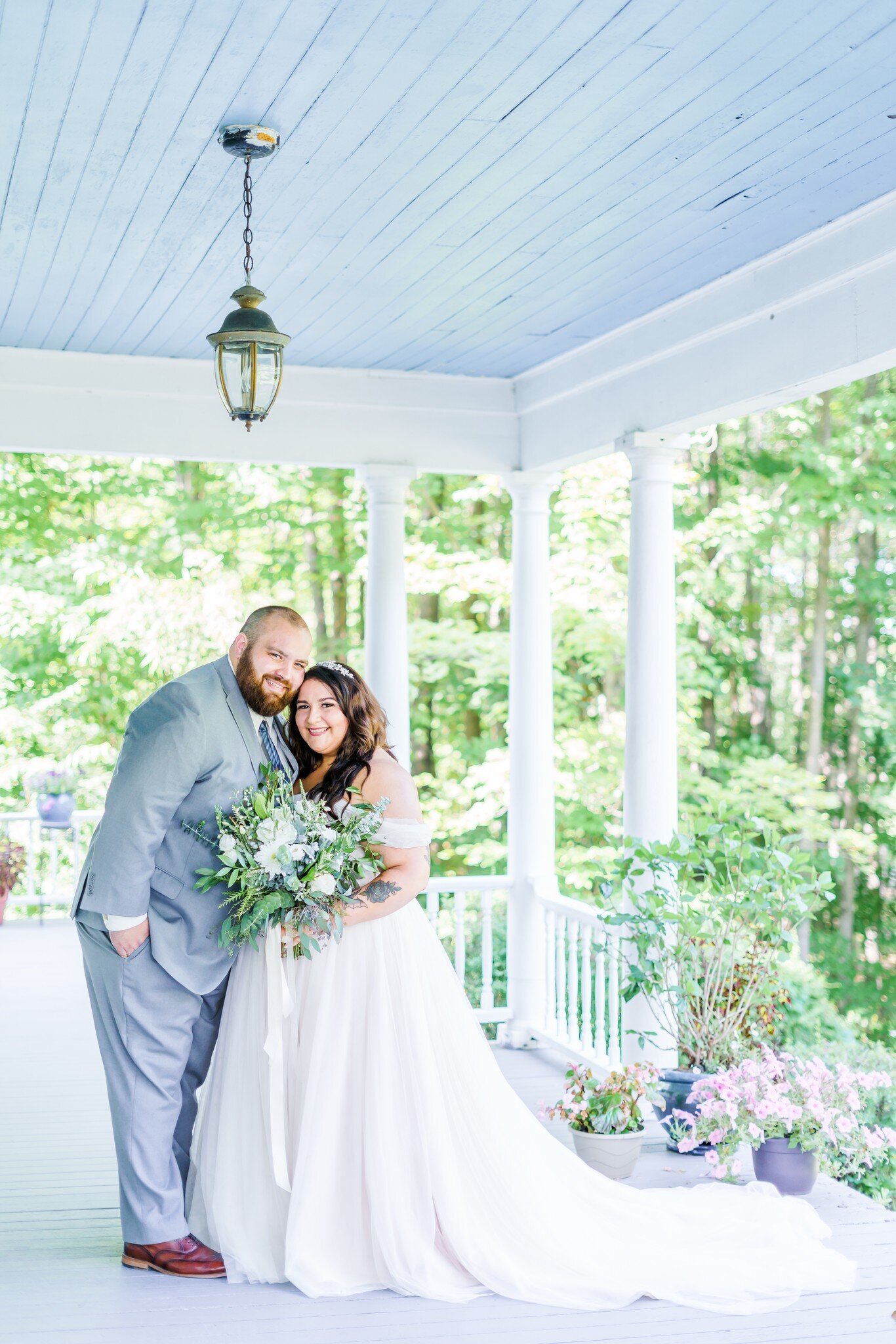 New England bride and groom with colorful bouquet