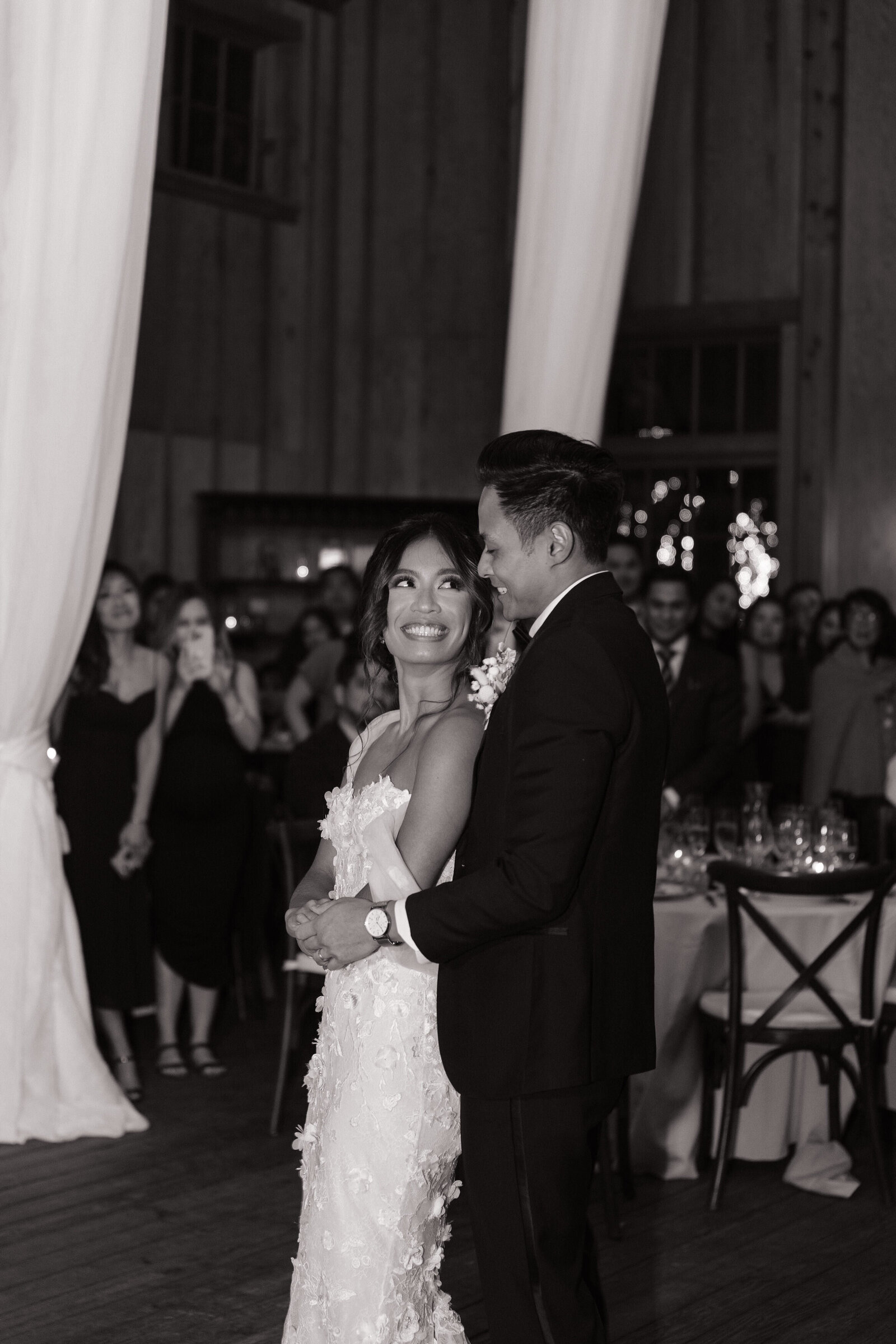 Couple embracing on the dance floor during Washington coastal wedding reception