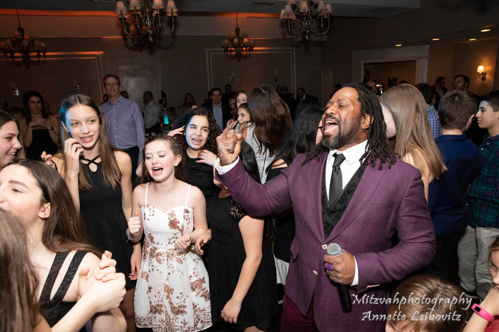 Chicago emcee leading a Bar Mitzvah celebration with guests dancing and laughing
