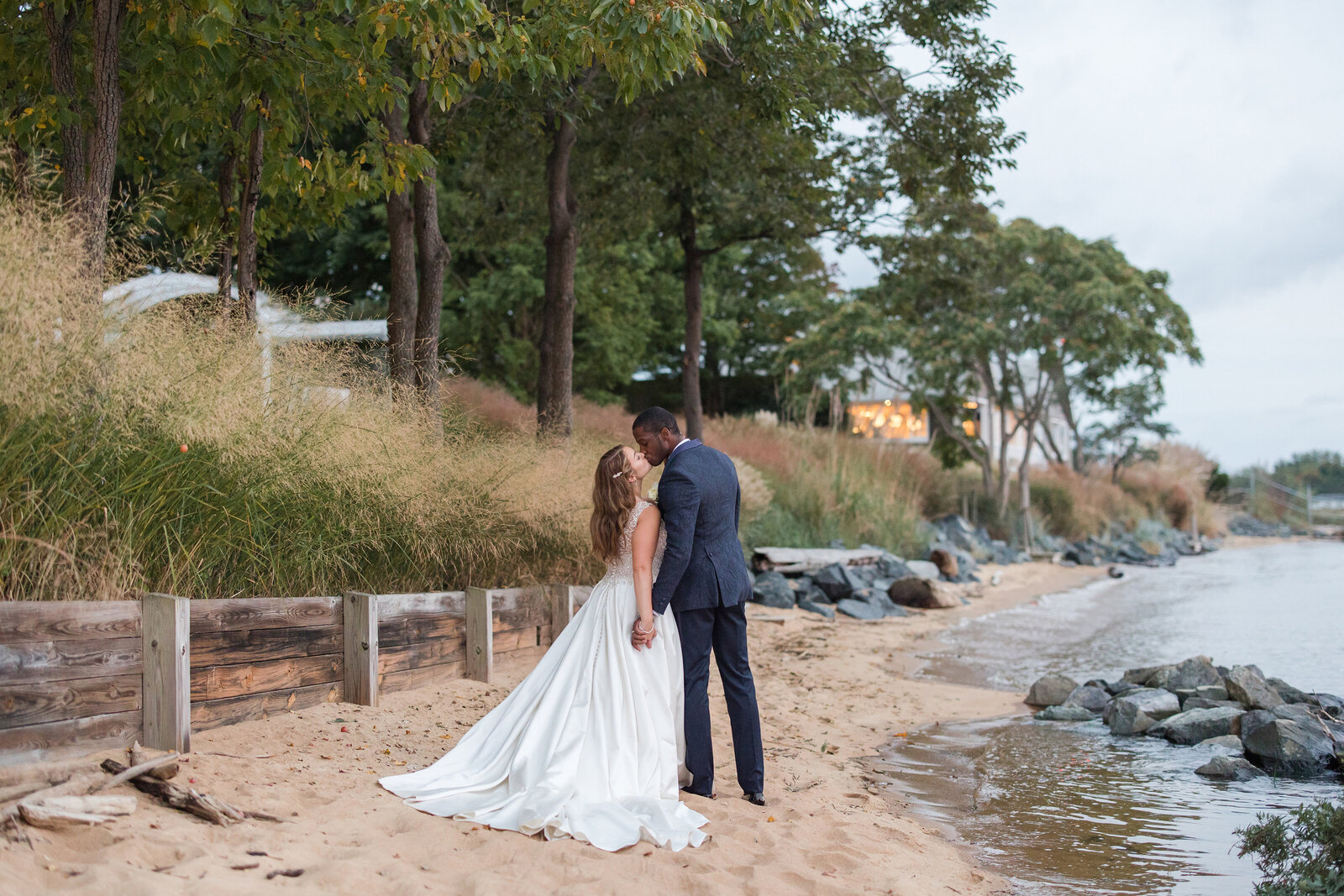 Chesapeake Bay Beach Club wedding photo of couple on beach by Annapolis Maryland photographer Christa Rae Photography