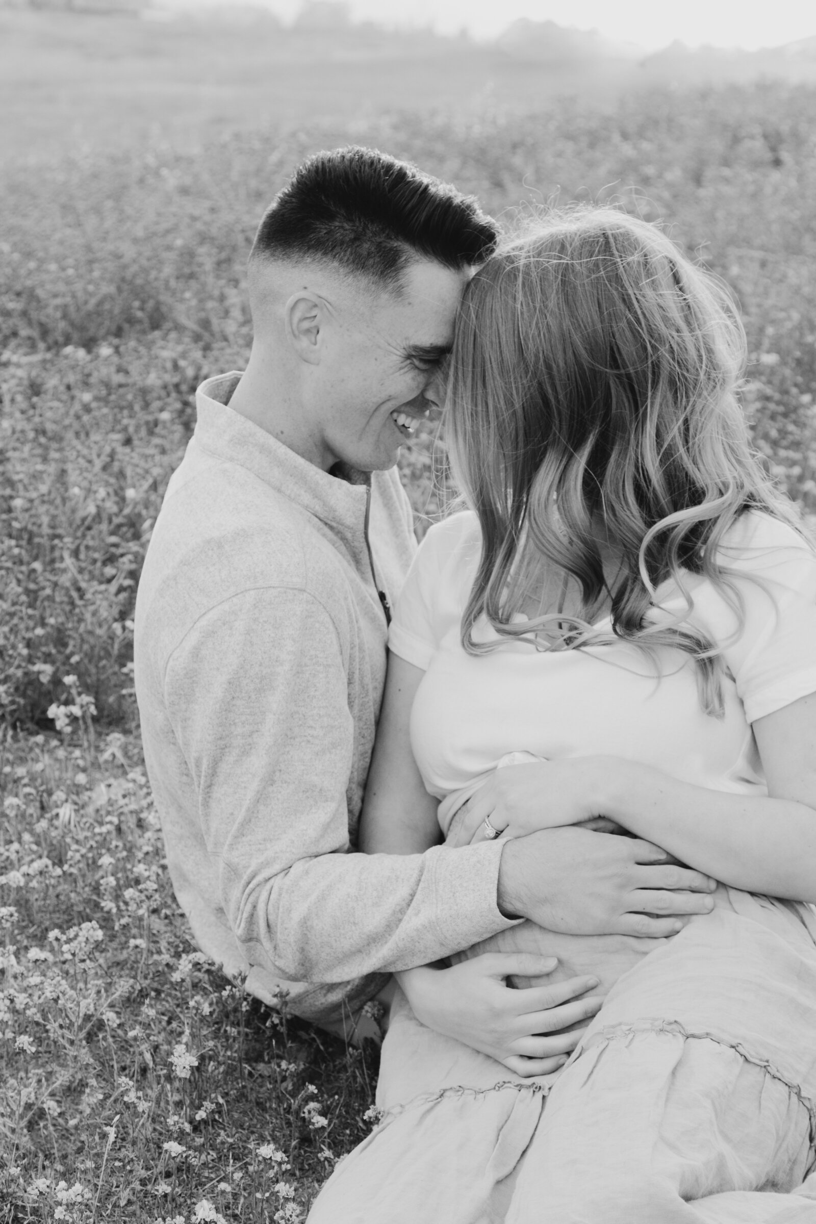 A pregnant woman poses for maternity photos with her family in Los Angeles, Ca.