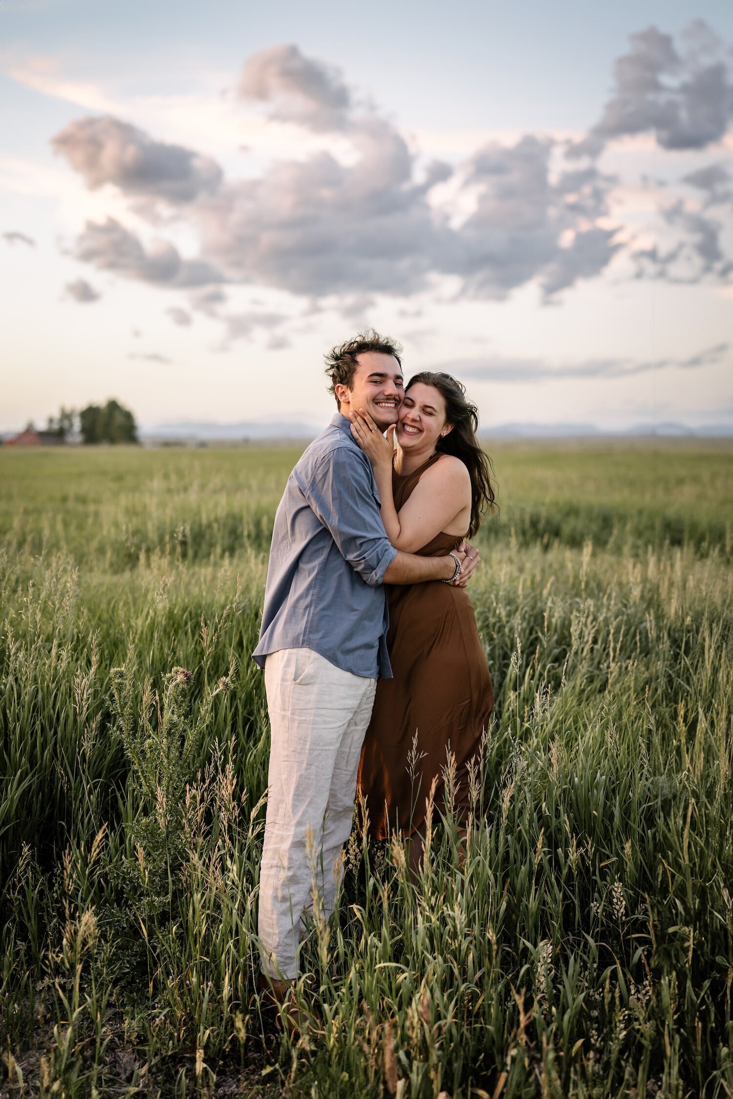 summer couple photos in a field of long grass