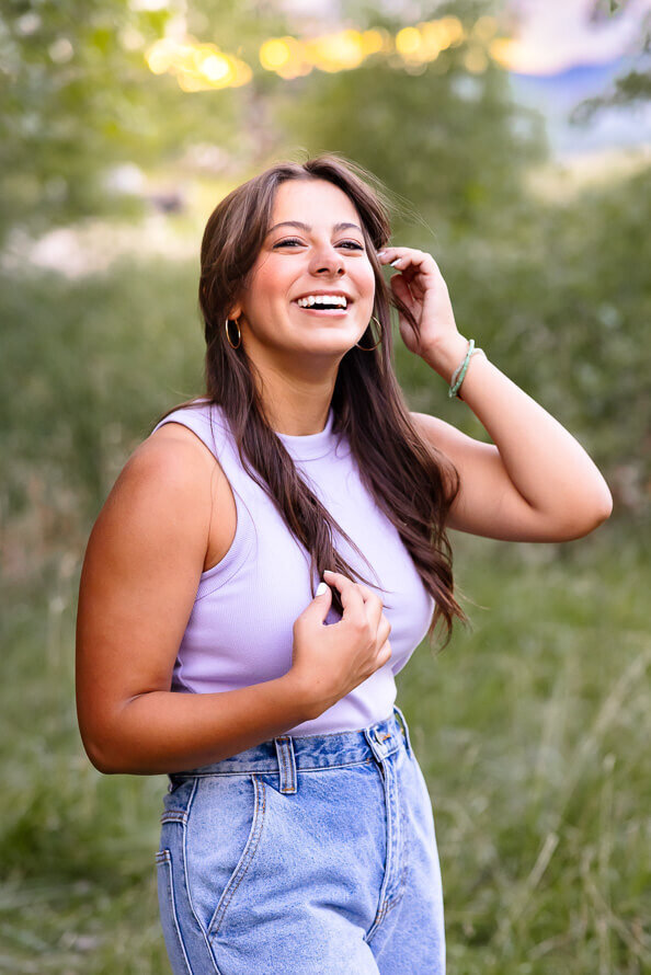 Girl fixes hair out at Fly N Park Park in Highlands Ranch, CO.