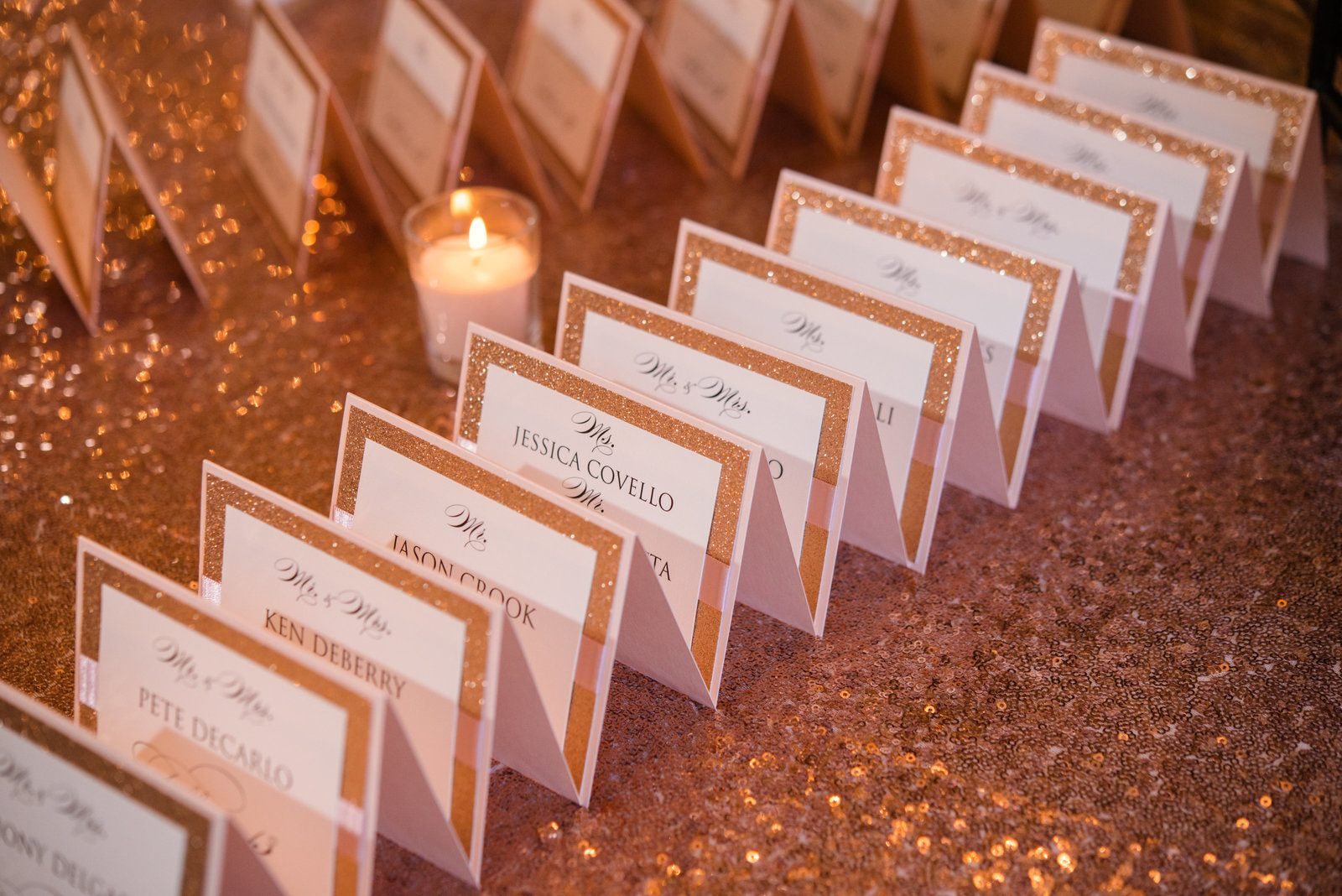 Gold and white place cards for a wedding at Glen Cove Mansion