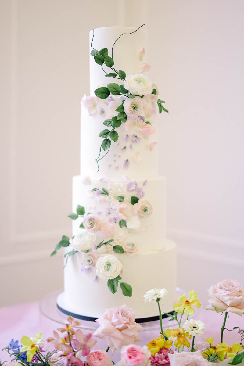 photo of elegant wedding cake with floral accents