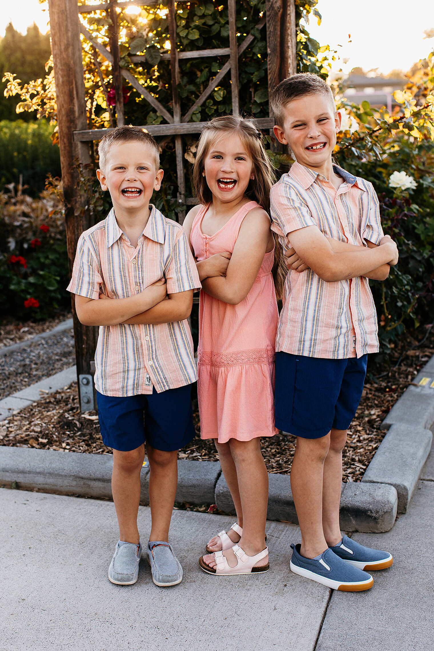 Bride and groom sitting in a vineyard kissing in Iowa