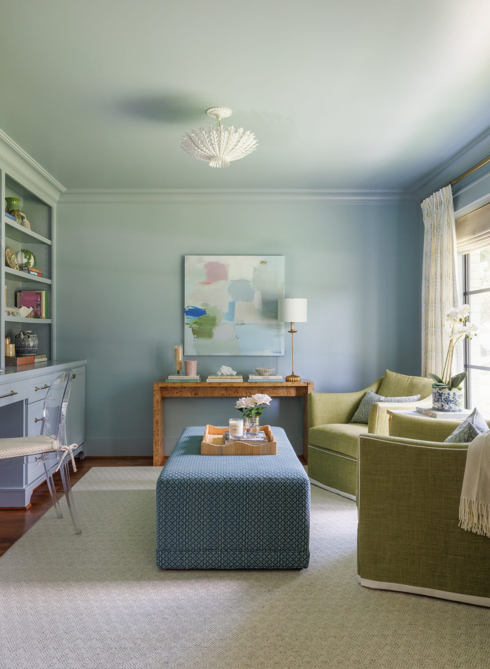 vision and hammer interior design sitting room with light blue painted walls and green chairs