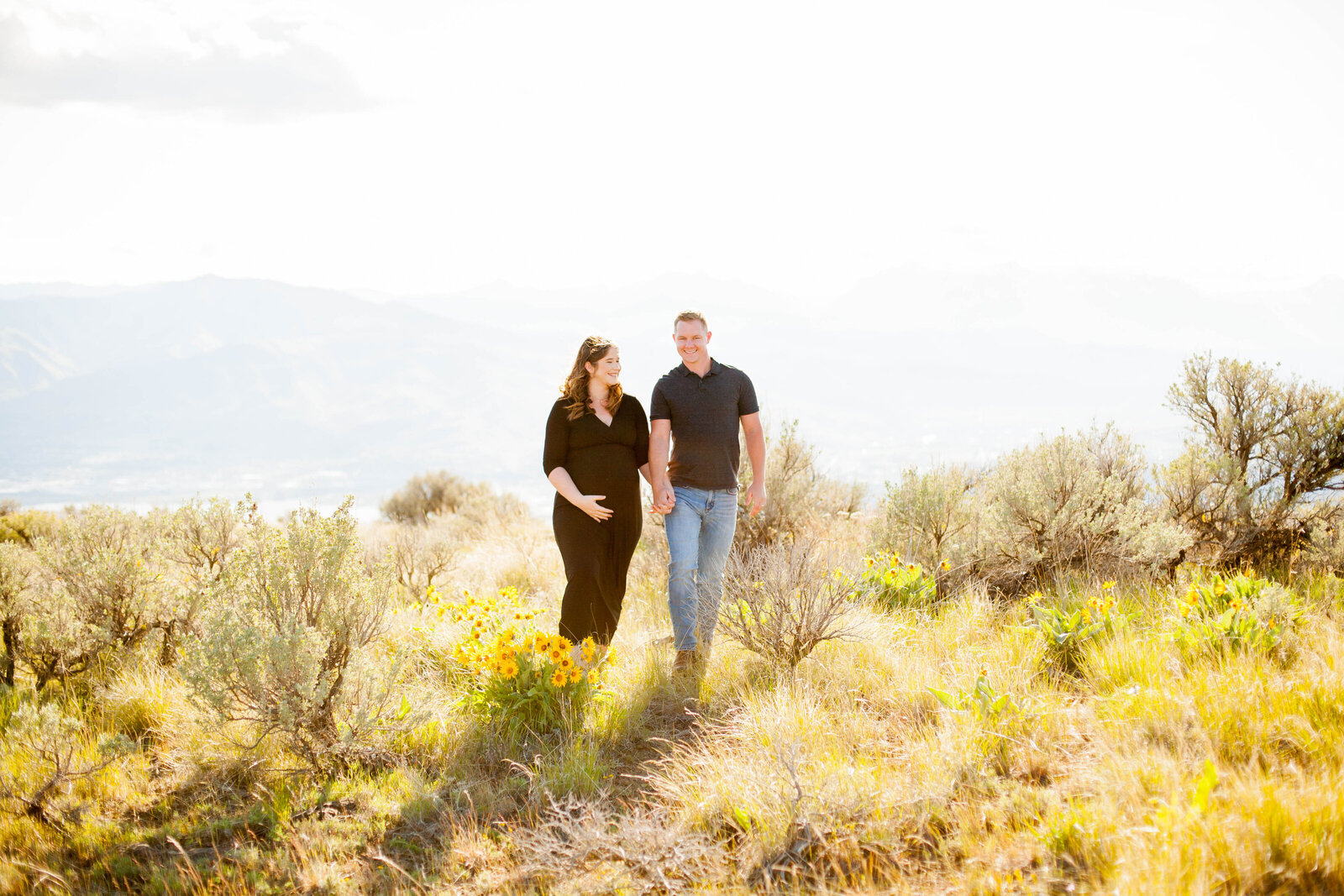 A man and woman holding hands during a Chelan photography session.
