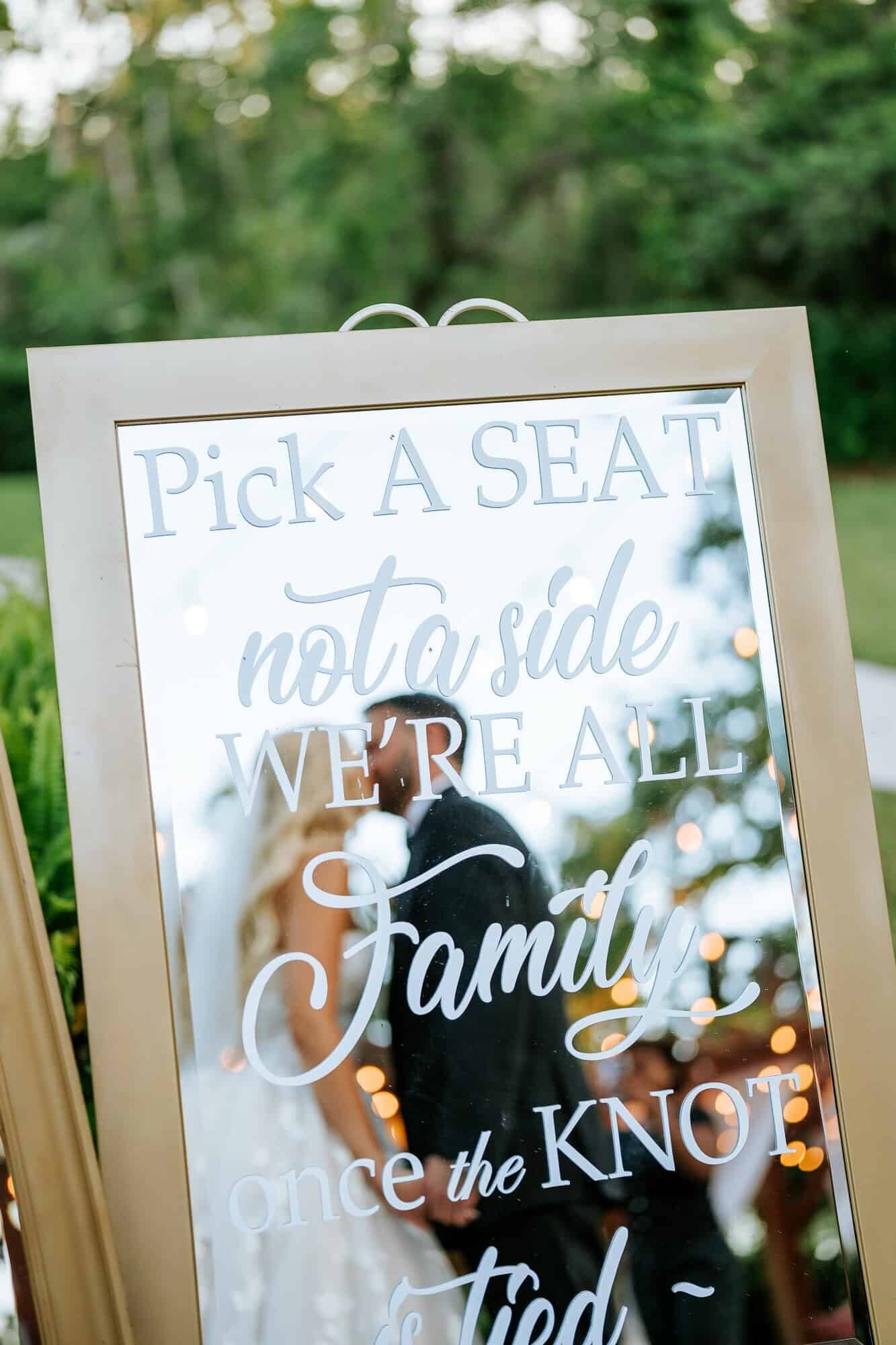 Bride and Groom kissing - mirror photo captured by Tampa wedding photographer
