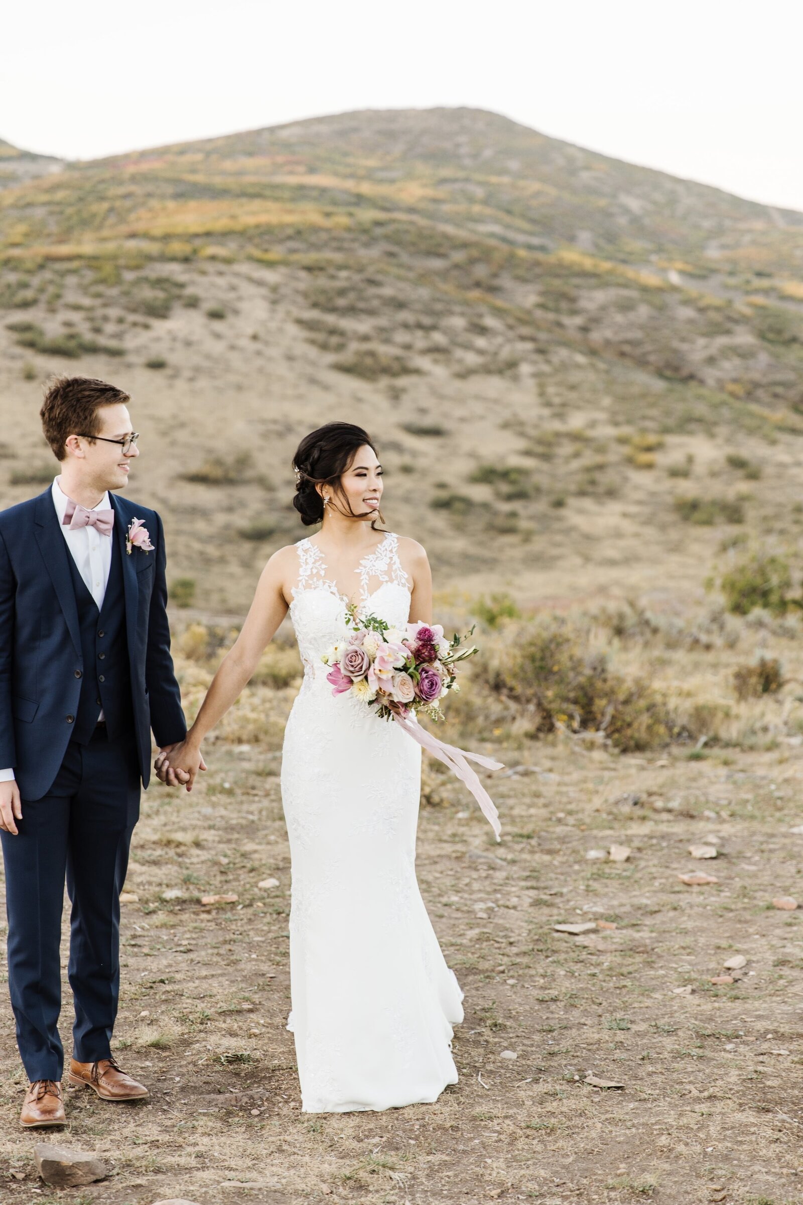 wedding photos with. mountain background