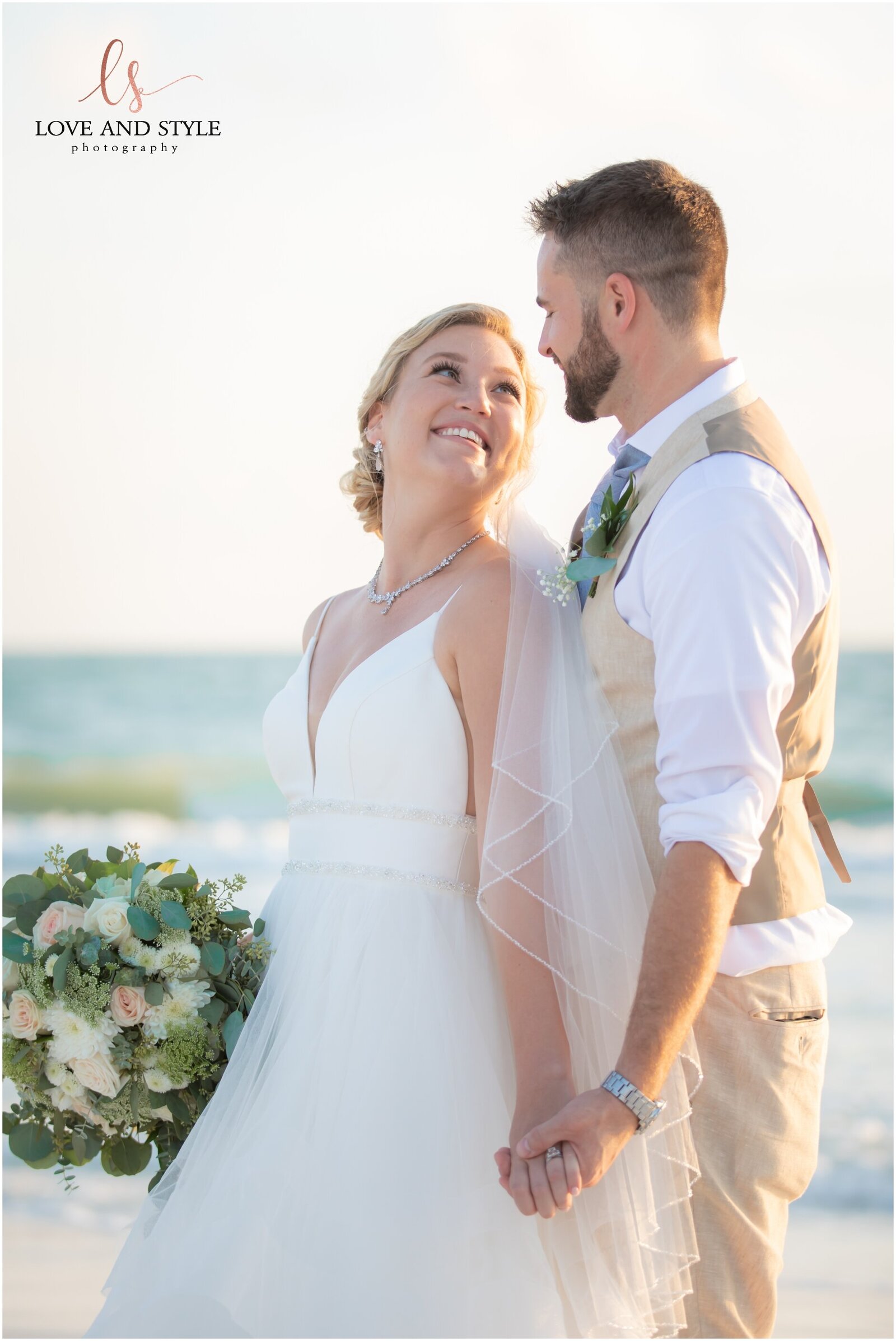 Bride and Groom in front of The Sandbar Restaurant on Anna Maria Island
