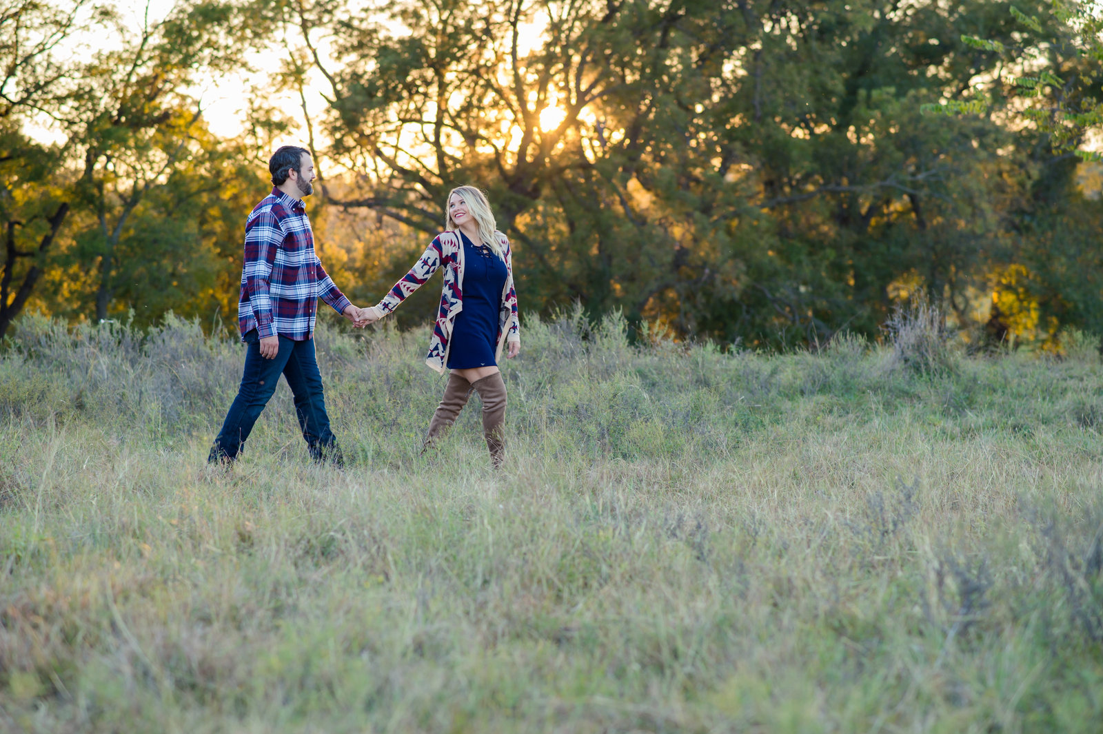 Engagement photo in field by Brittany Barclay Photography