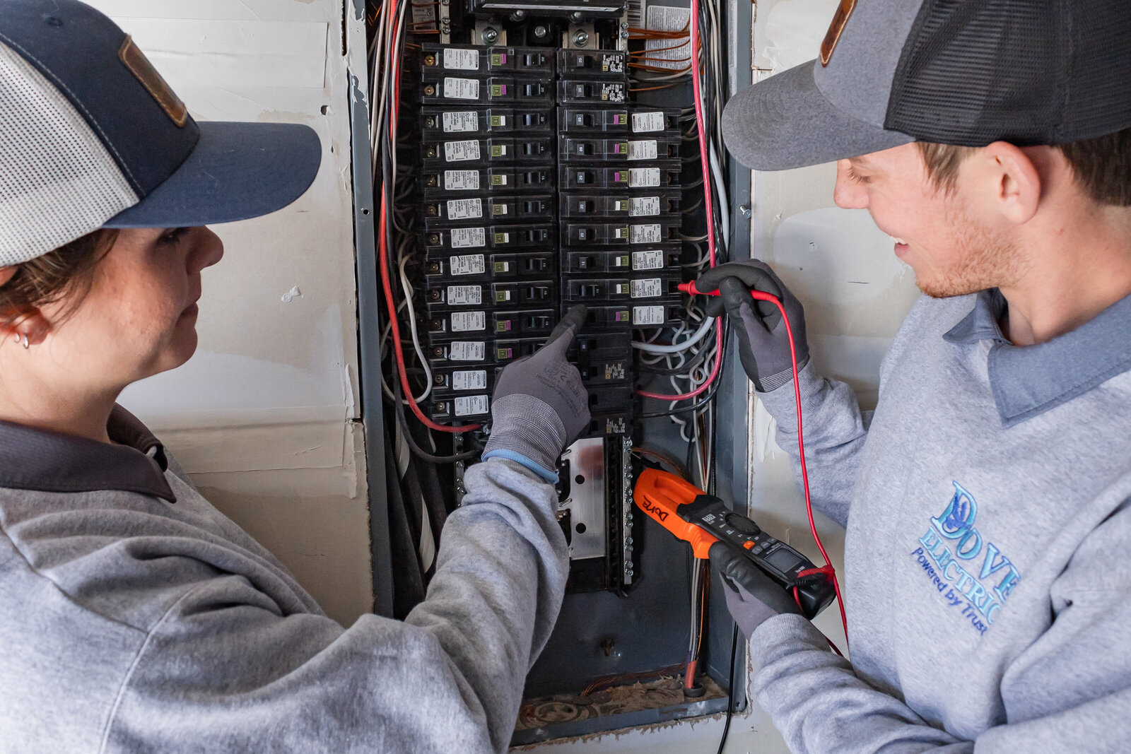 Electricians in Albuquerque working on an electric panel