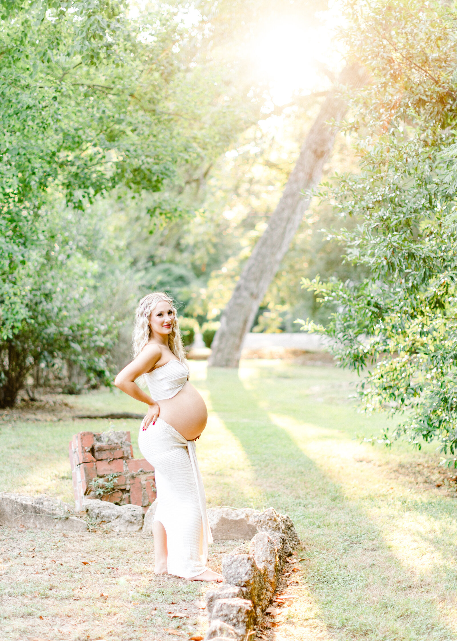 Cassidy maternity portrait in a glowing garden, captured by Abby Bell Photography, Fine Art Portrait Photographer based in Alabama.