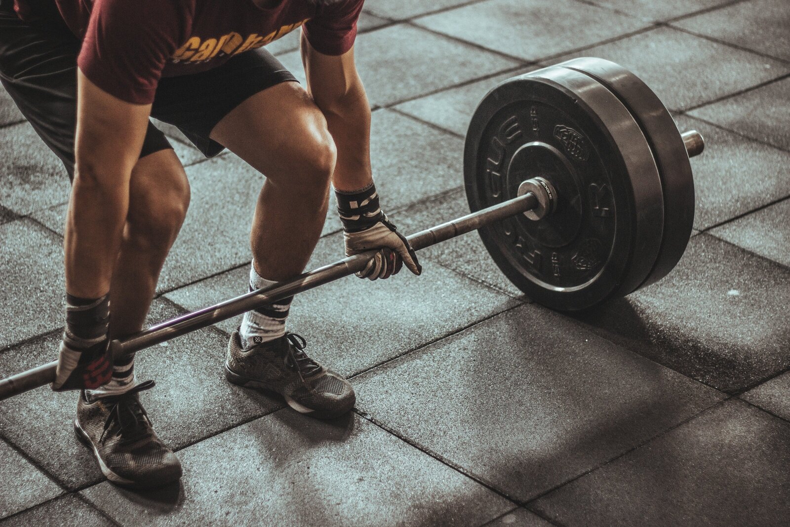 Man lifting weights in a gym