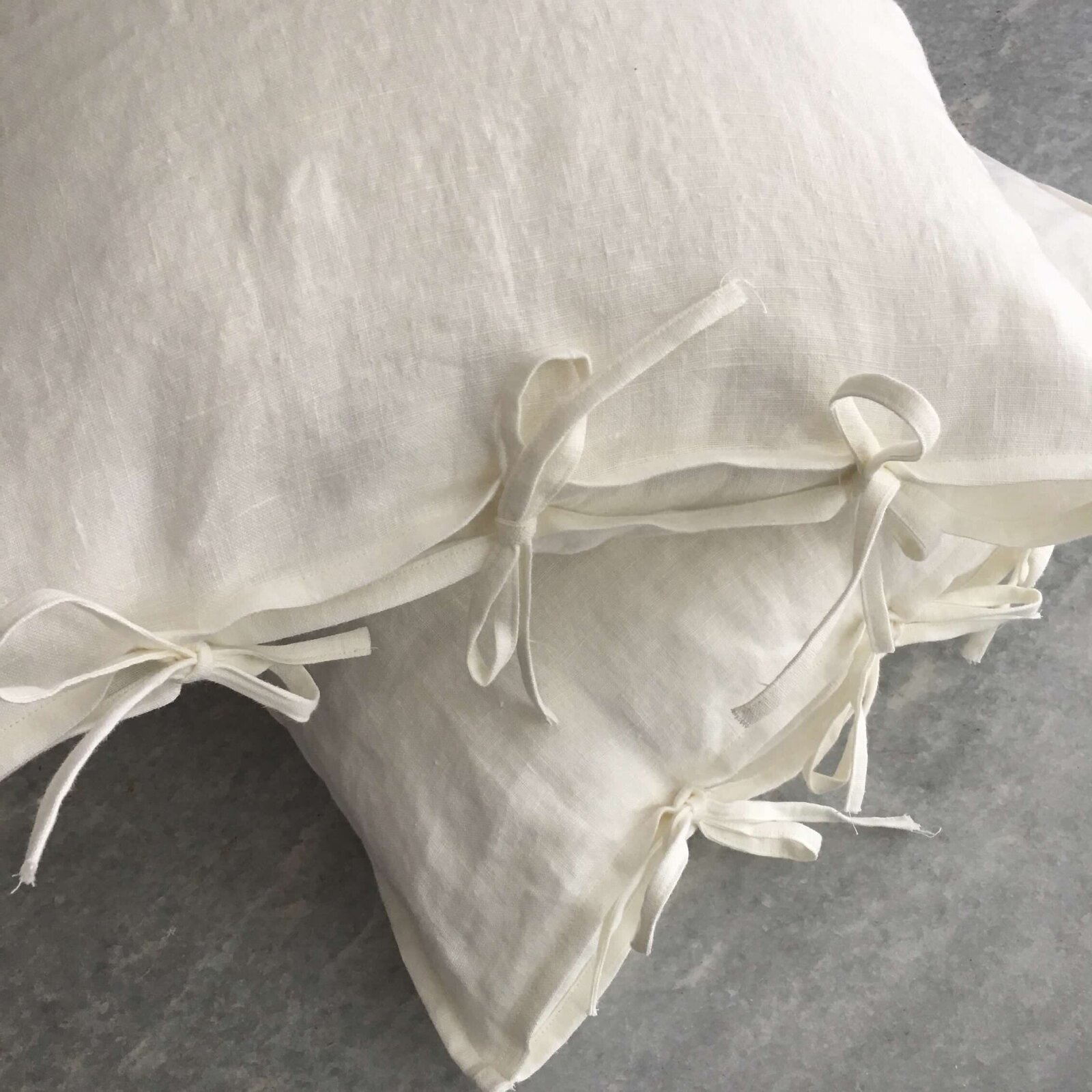 White linen pillowcases with ties on edges
