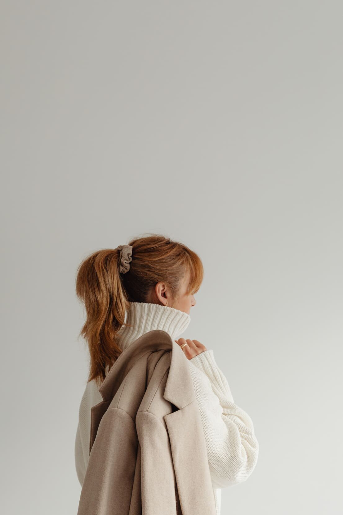 kaboompics_woman-in-white-sweater-beige-wool-jacket-29429