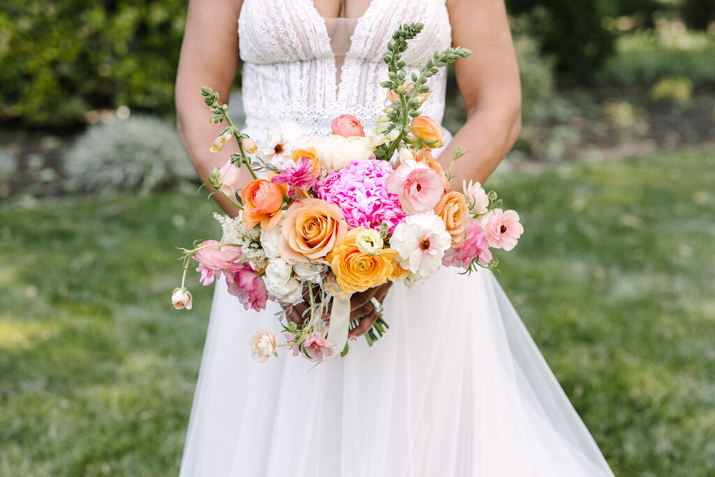 Bride holding her bouquet for an outdoor wedding