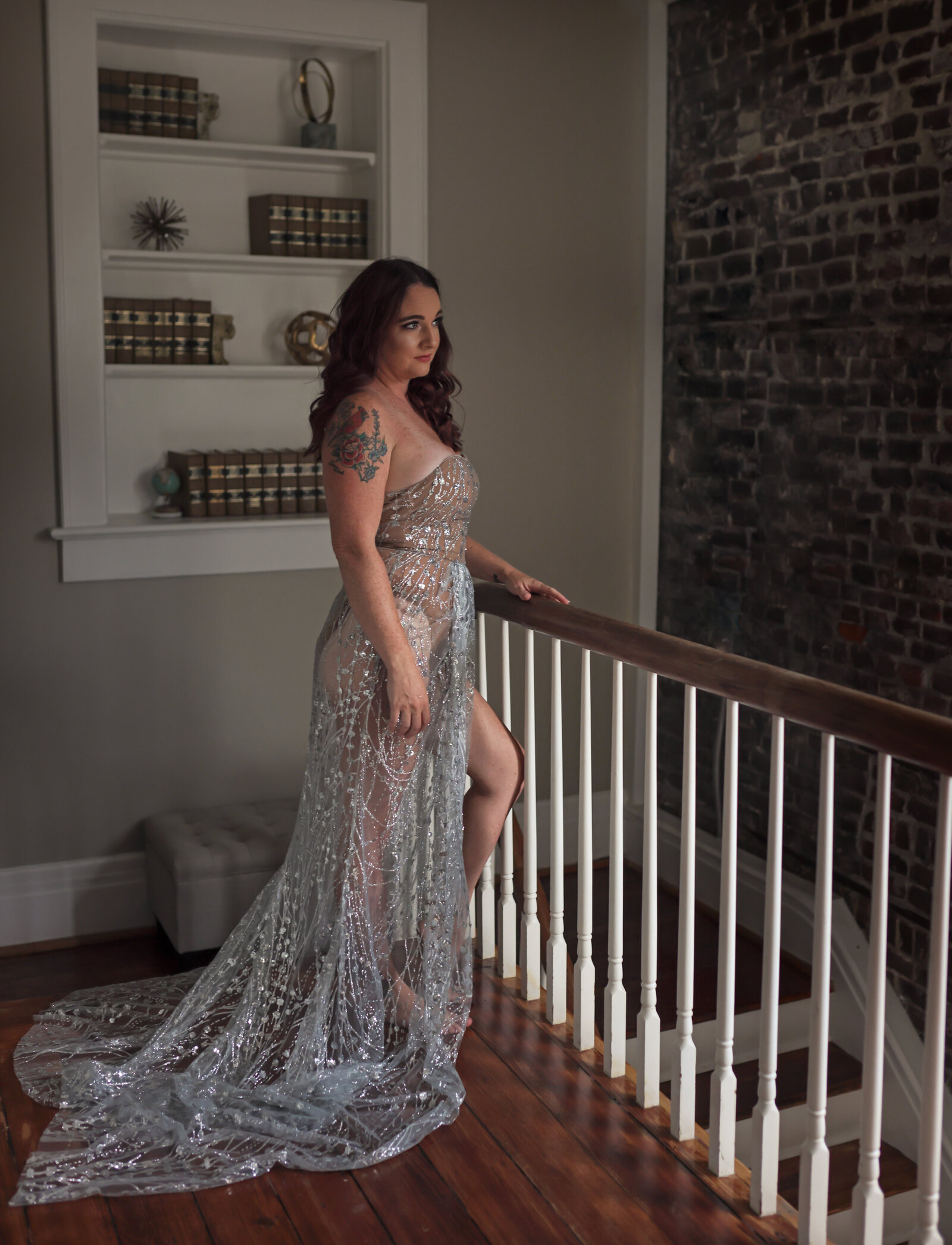 Savannah Boudoir Photography and Glamour showcases gorgeous red headed woman in silver designer glamour gown