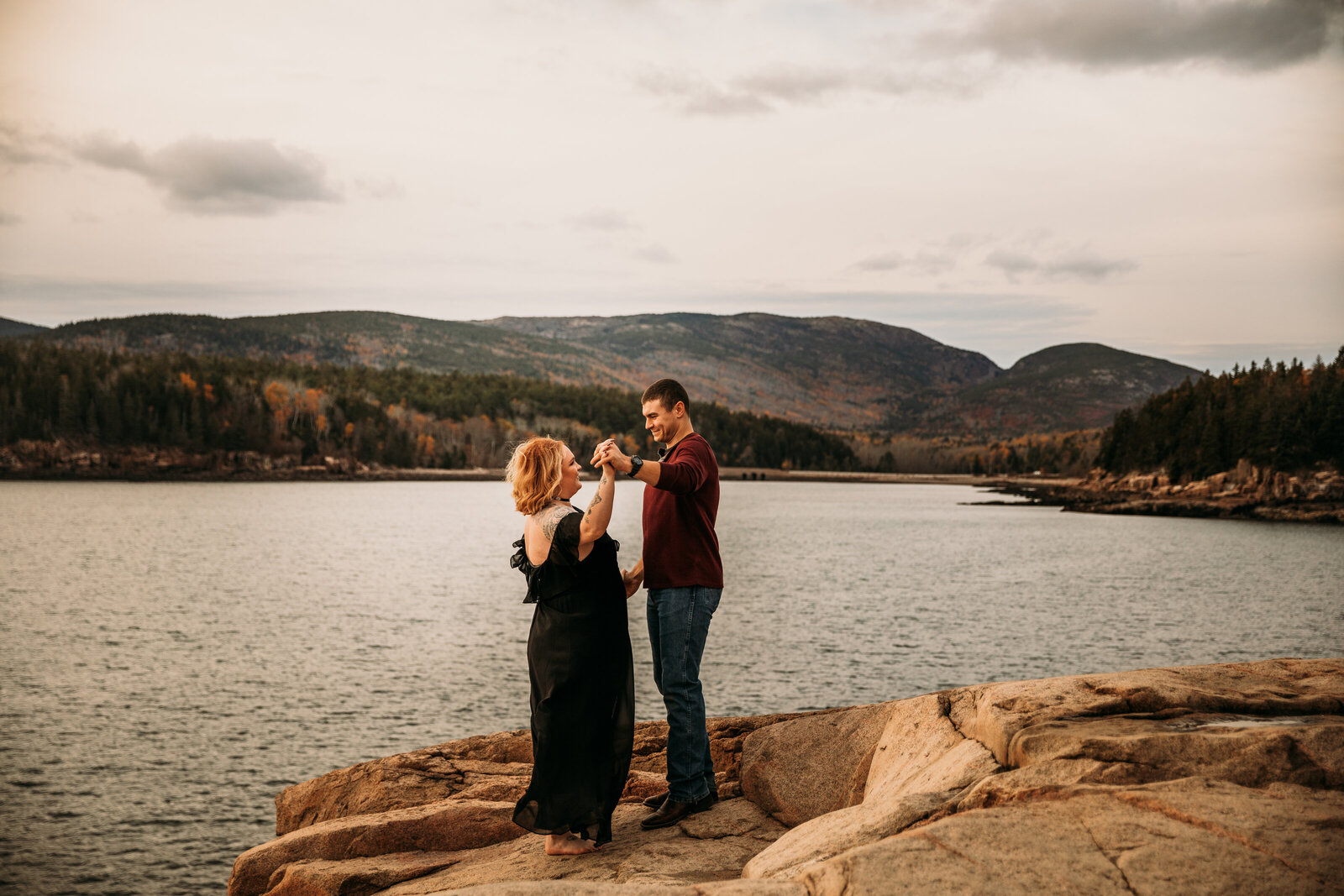 acadia national park engagement session white couple dancing on cliff