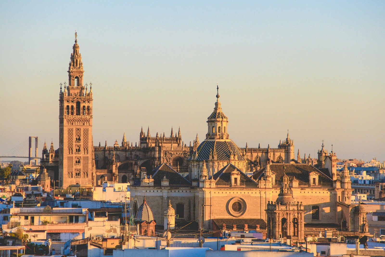 Skyline of Seville Spain featuring La Giralda belltower and Seville Caathedral at golden hour