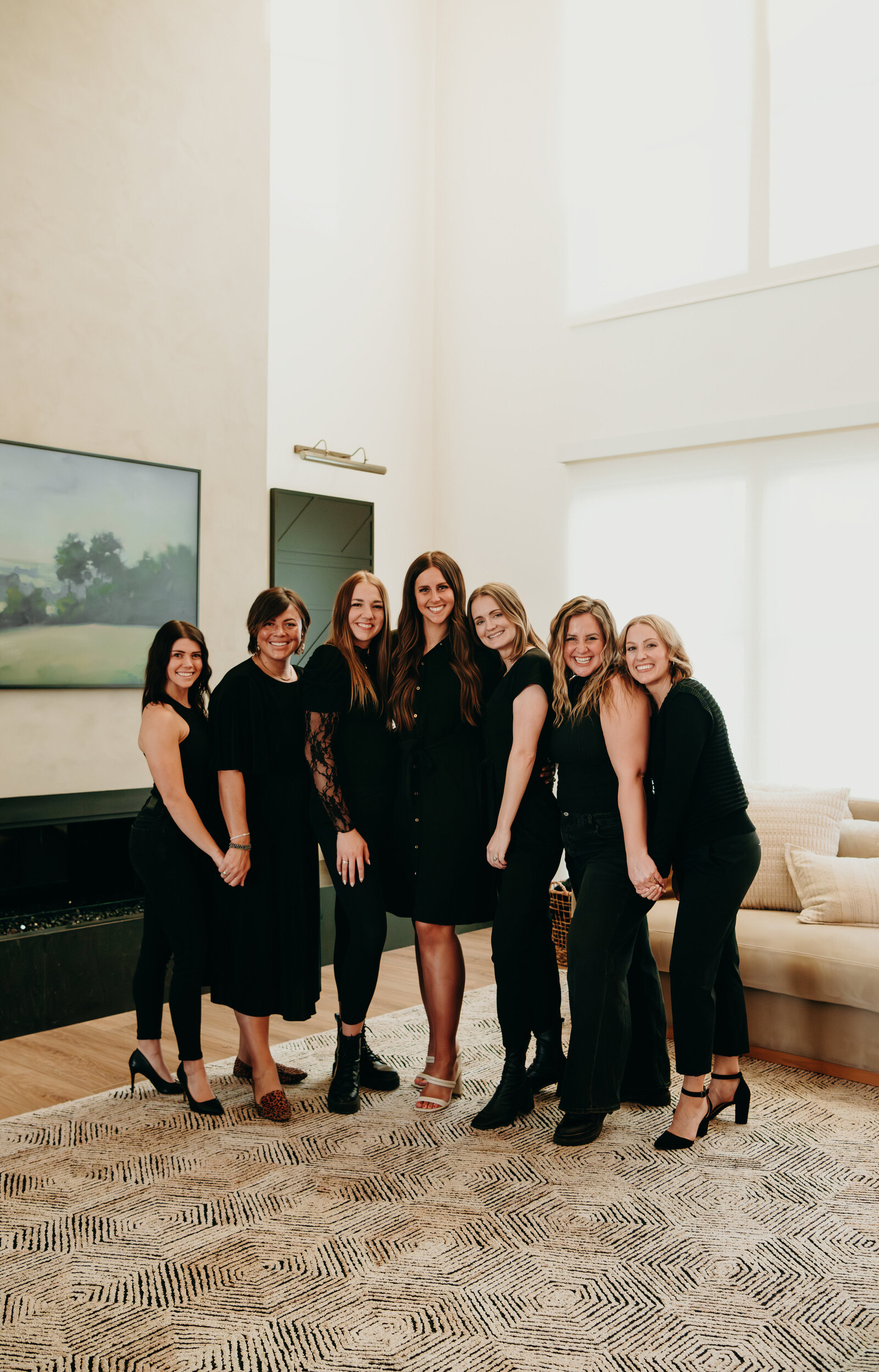 Andrea Wilde, CEO and founder of the LIVE BIG Collective with all the LIVE BIG Coaches, smiling, happy, confident