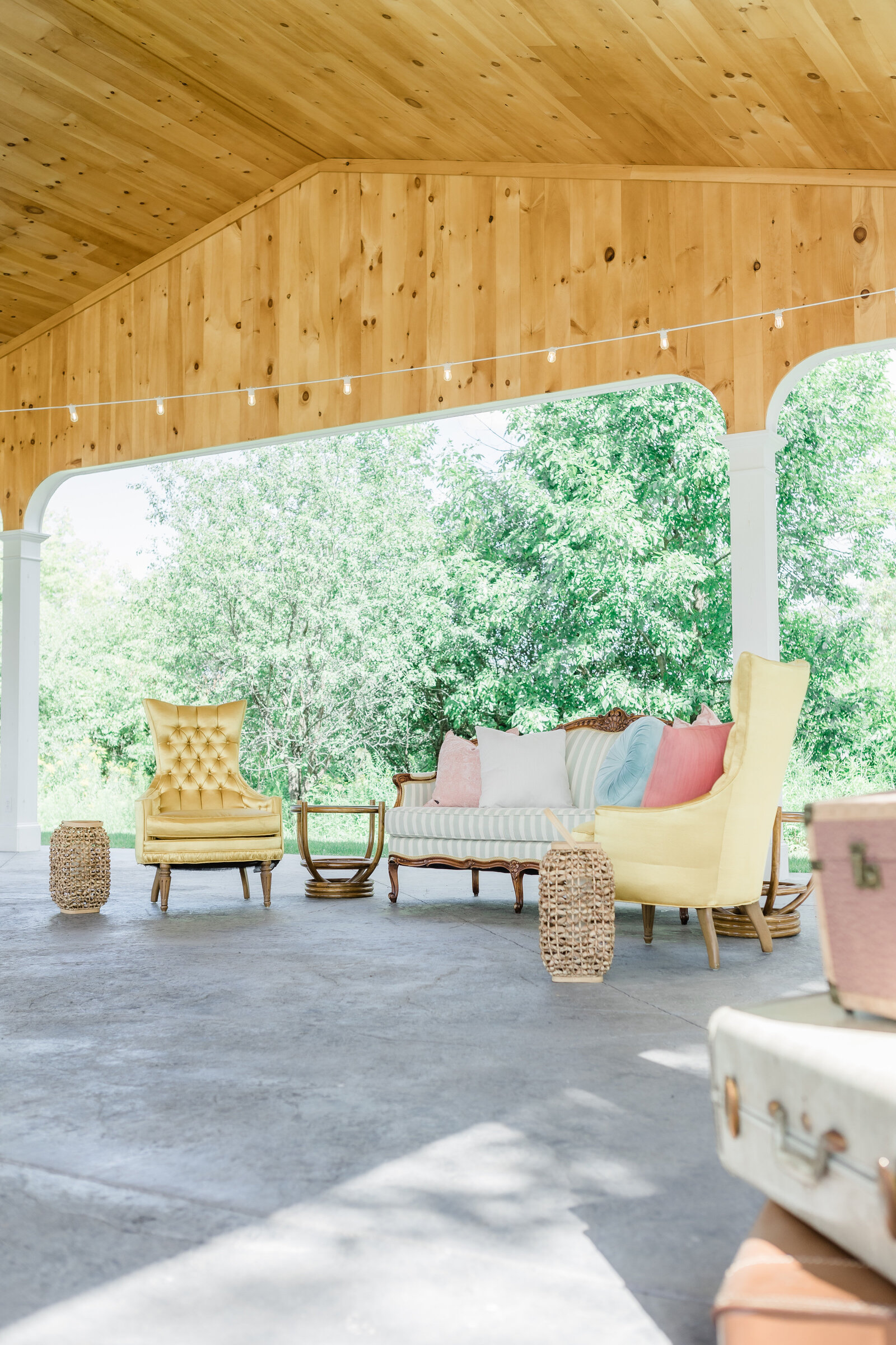colorful vintage lounge in light filled event pavilion with wood interior ceilings